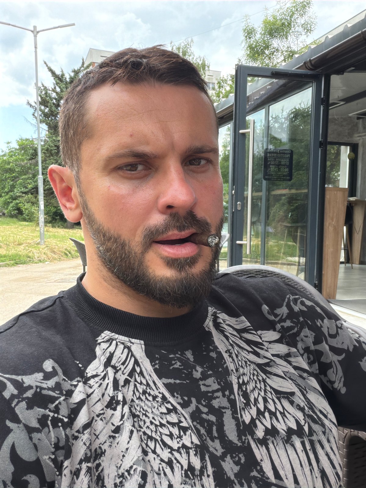 Man enjoys dessert at Sofia cafe during afternoon visit