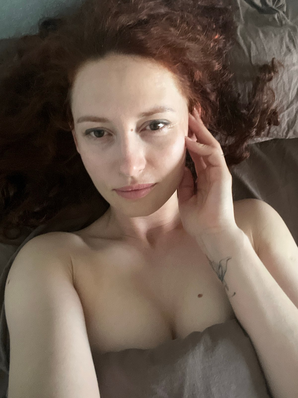 Person with red hair observed lying in bed in Saint Petersburg