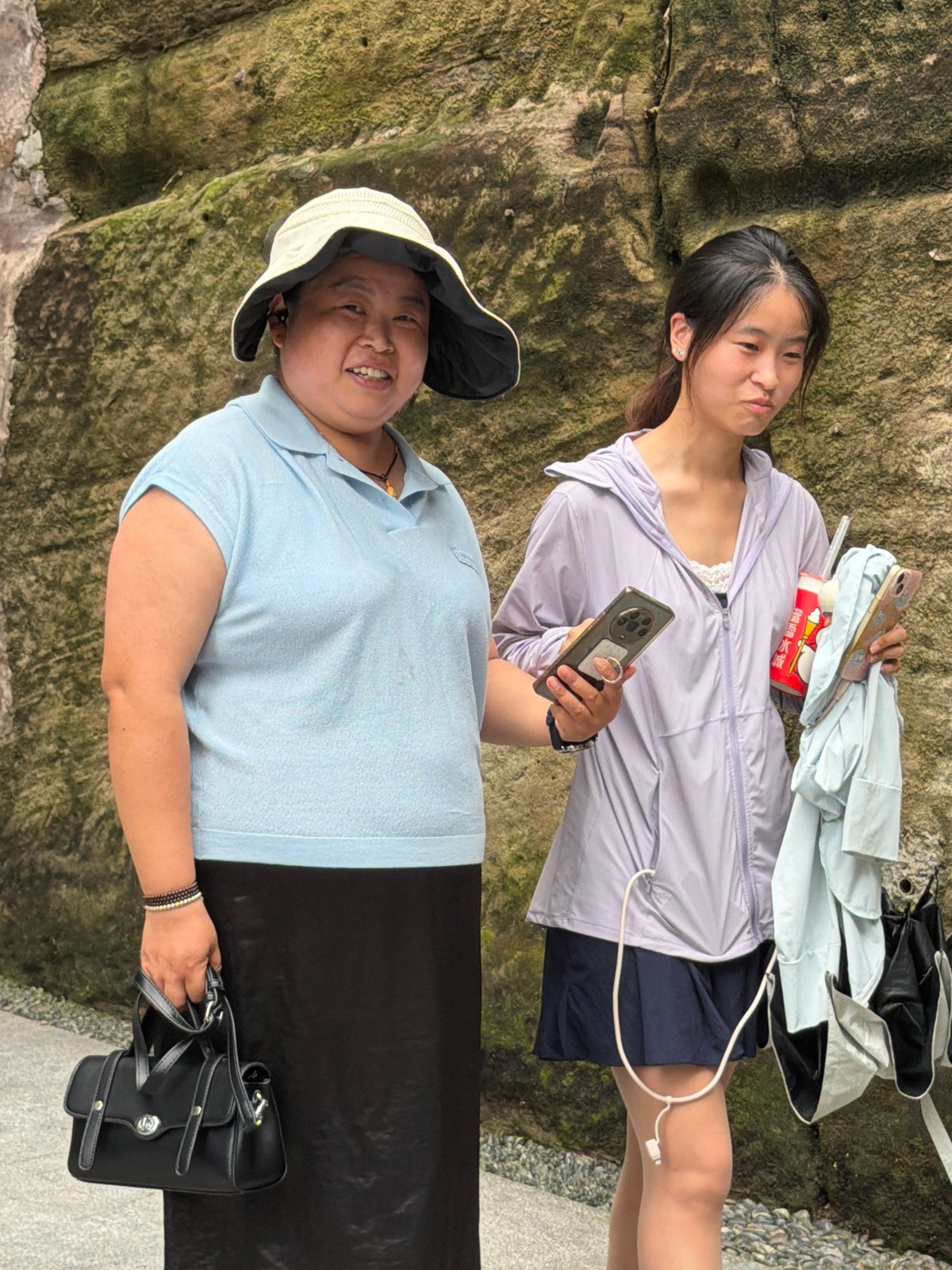 Bronze warrior monuments and street life at a Yuzhong District historic site