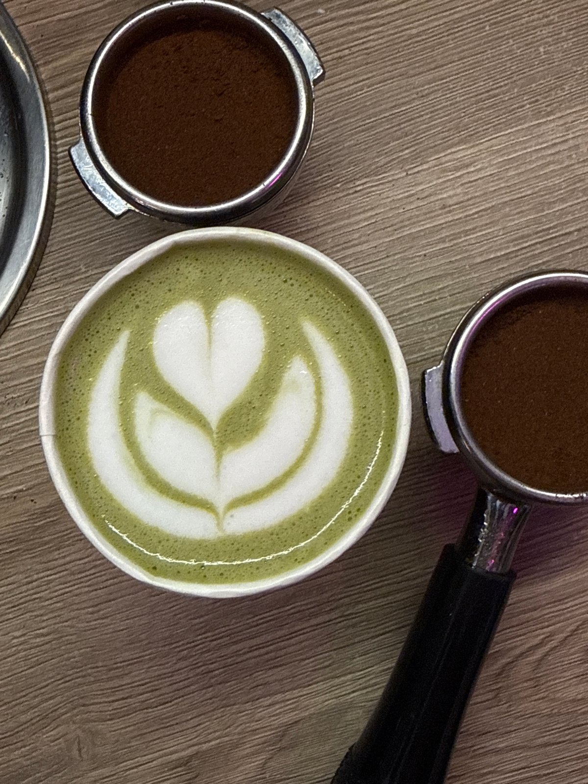 Green matcha latte prepared at Moscow coffee station