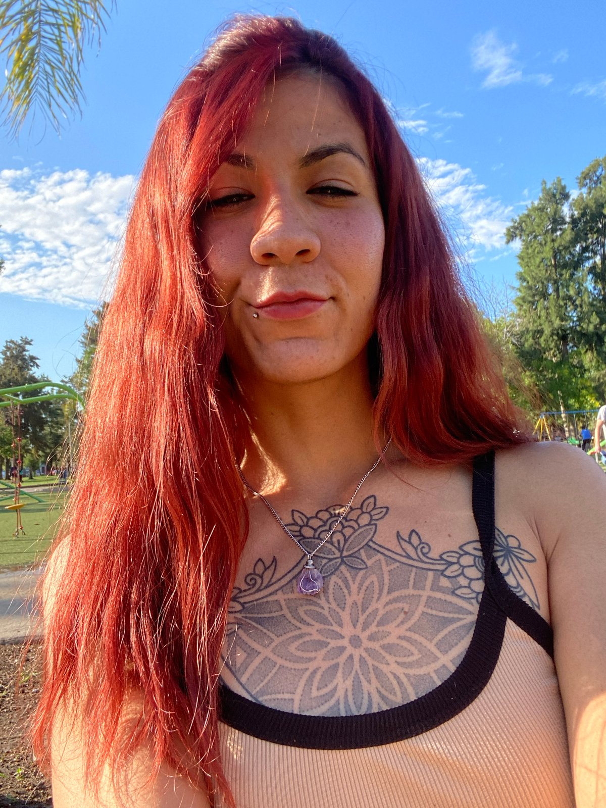 Woman takes selfies at Villa Domínico park