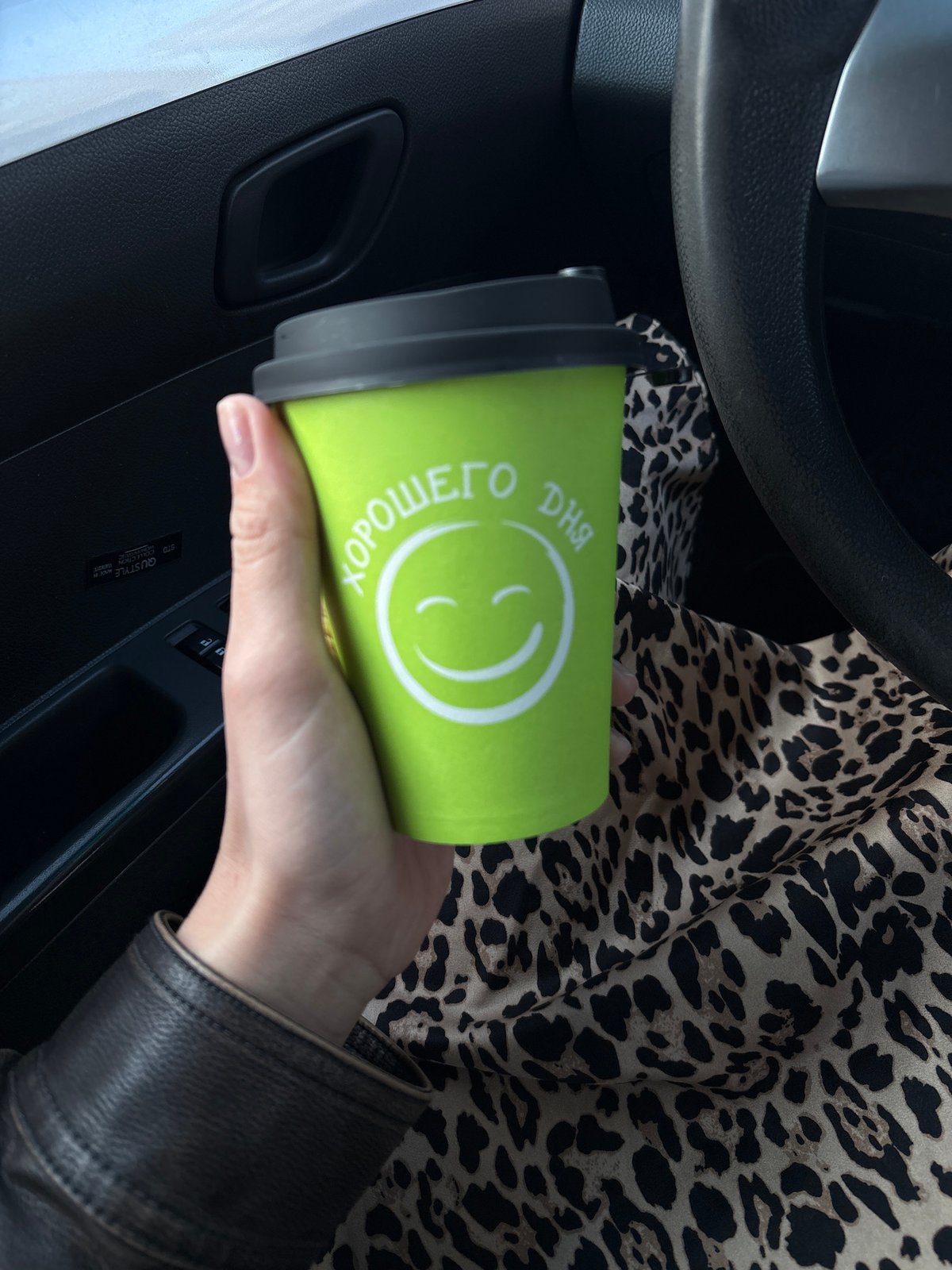 Driver enjoys morning coffee during commute in Ust-Ilimsk
