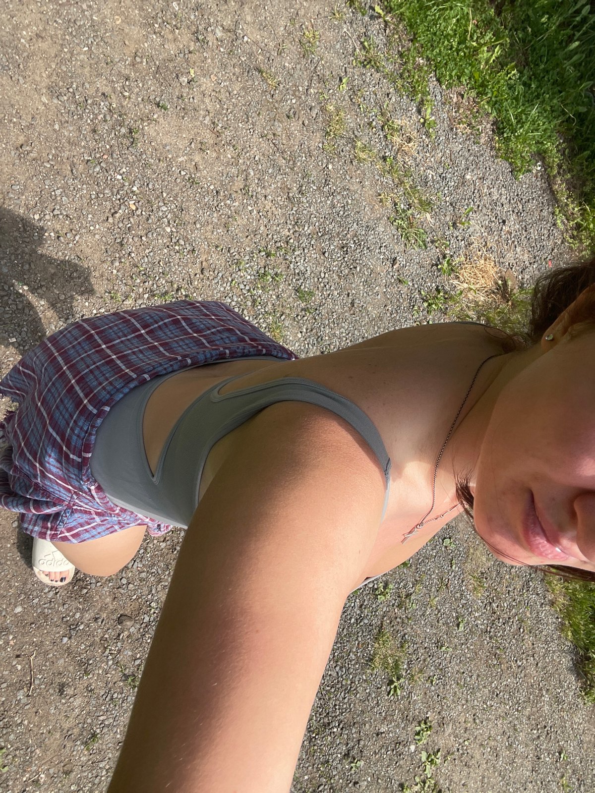 Woman takes sunny day selfies in Misaylovo, Russia