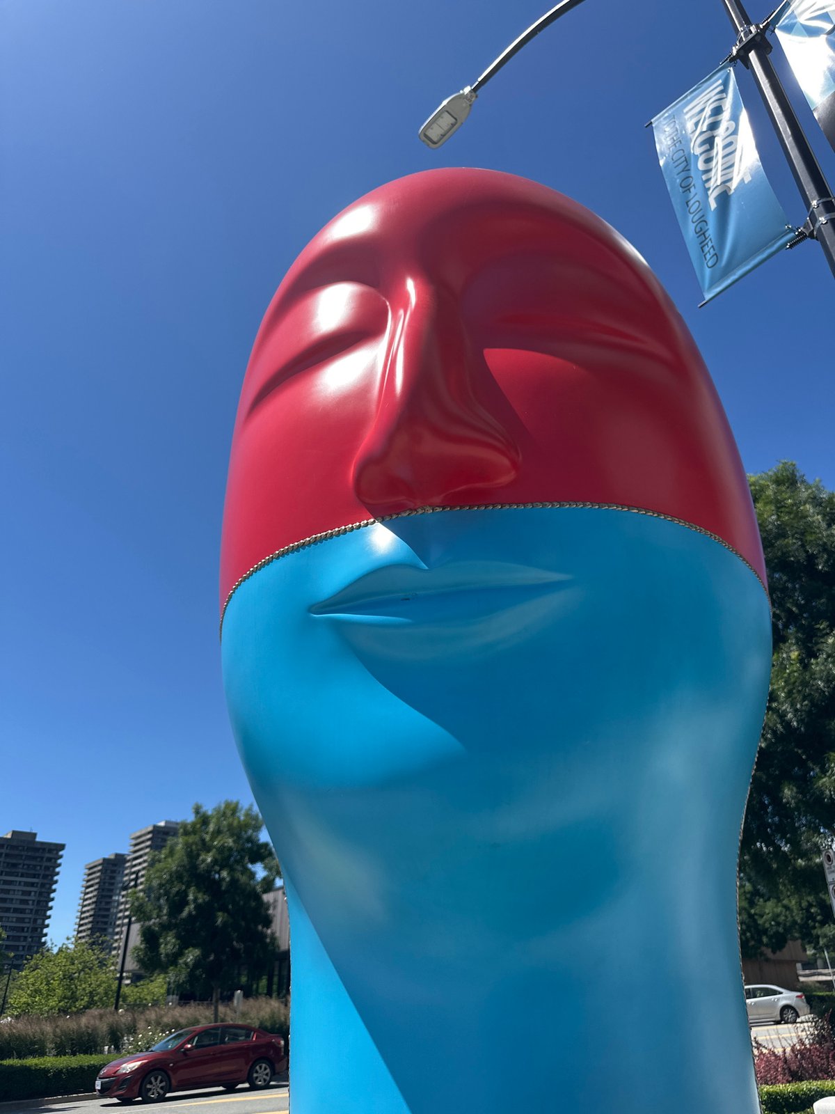 Colorful head sculptures and lavender blooms in Burnaby