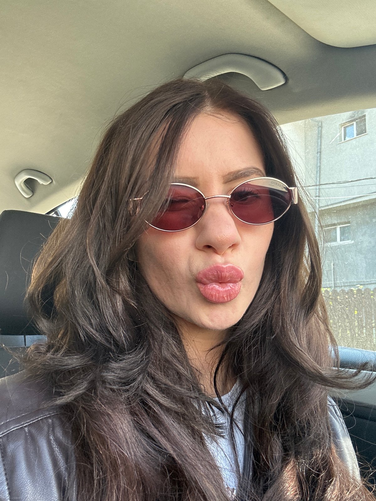 Woman takes morning selfies in vehicle in Plovdiv