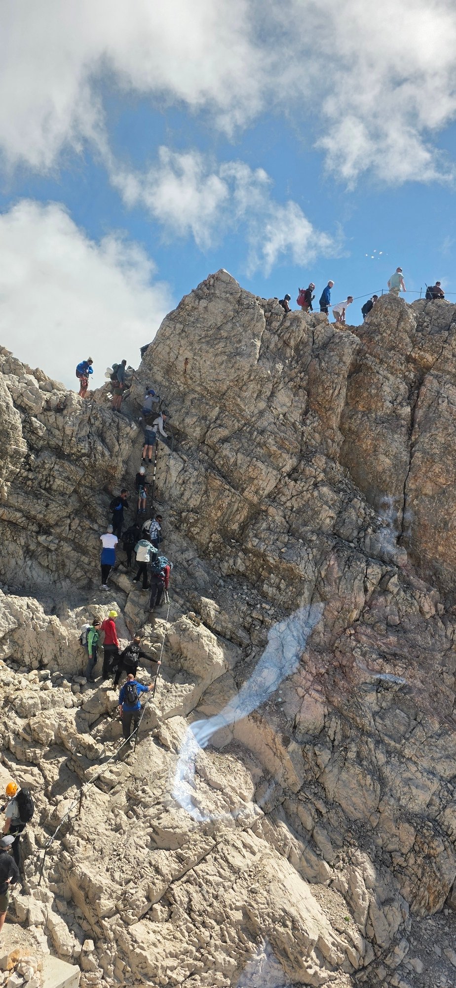 Via ferrata ascent on a rocky mountain face near Grainau