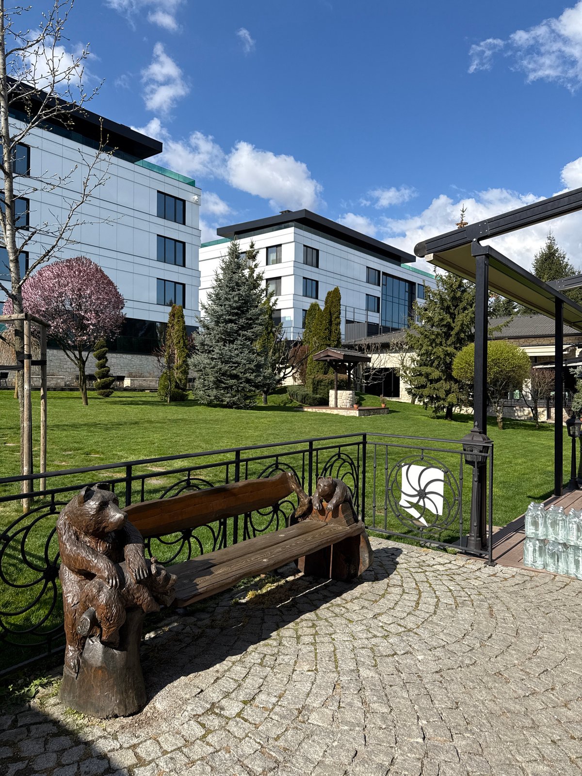 Modern building and manicured garden observed in Sofia