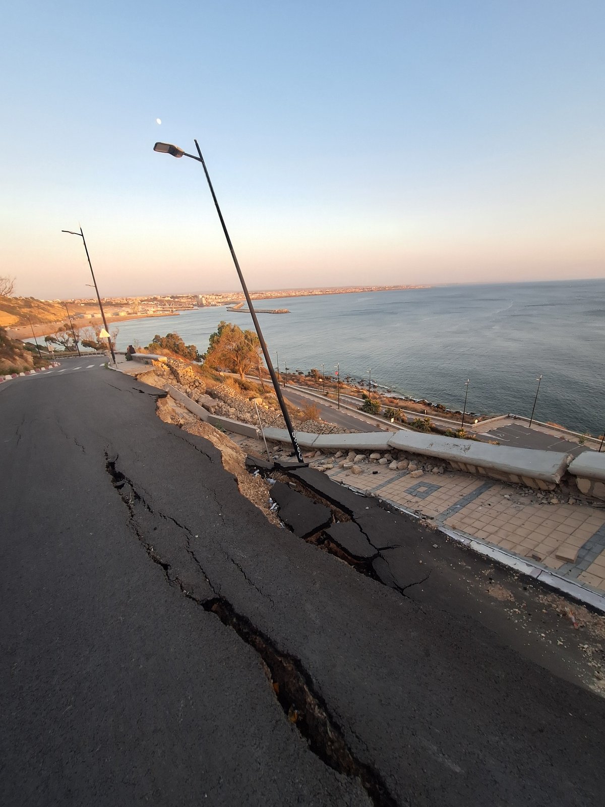 Coastal road damage documented at dusk in Safi, Morocco