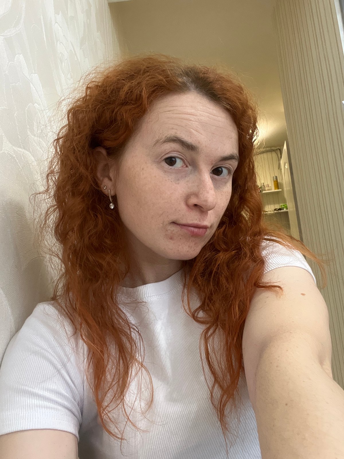 Woman takes selfies indoors in Chaikovsky, Russia