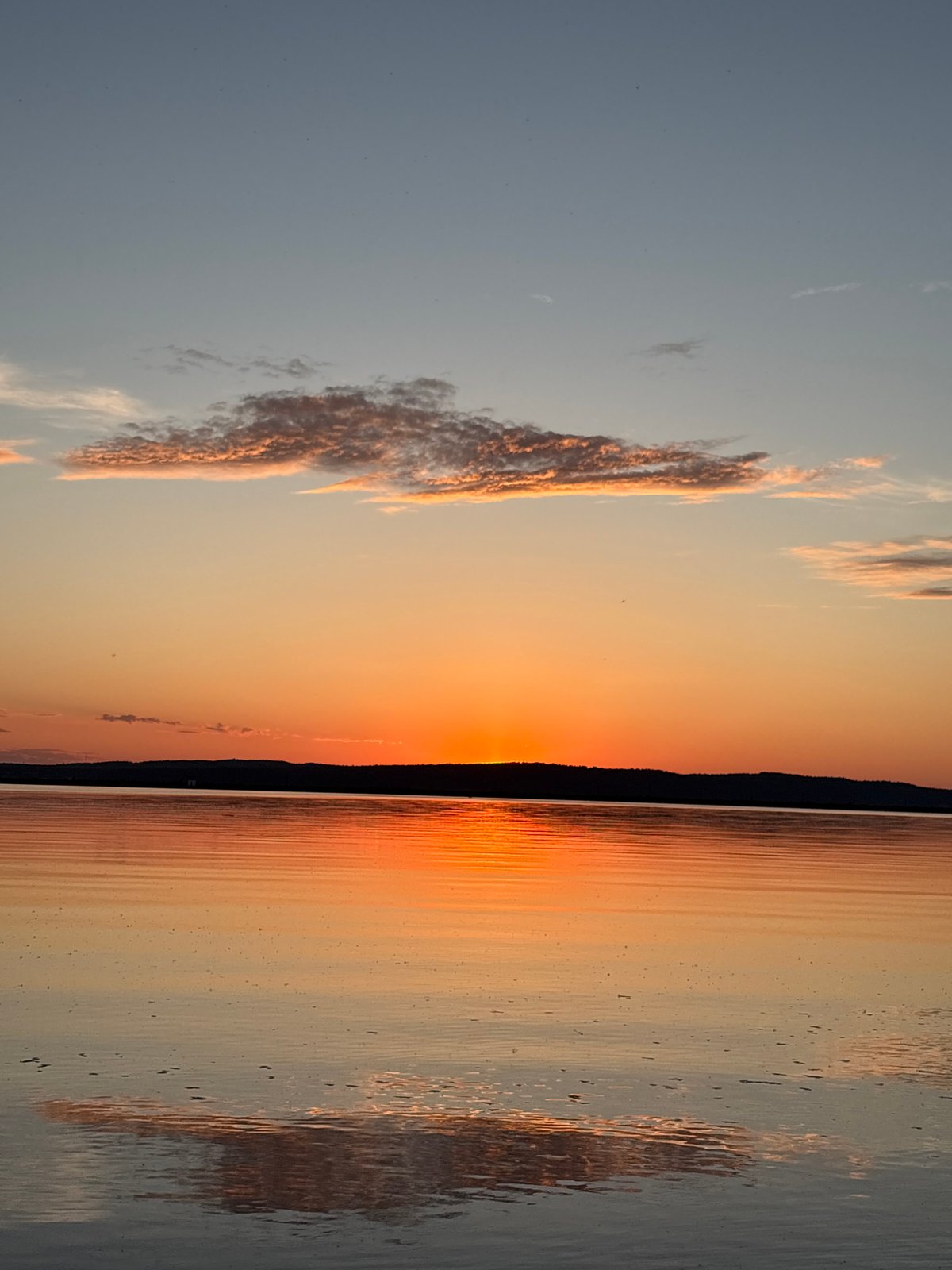 Sunset gathering documented at Chaikovsky waterfront, Russia