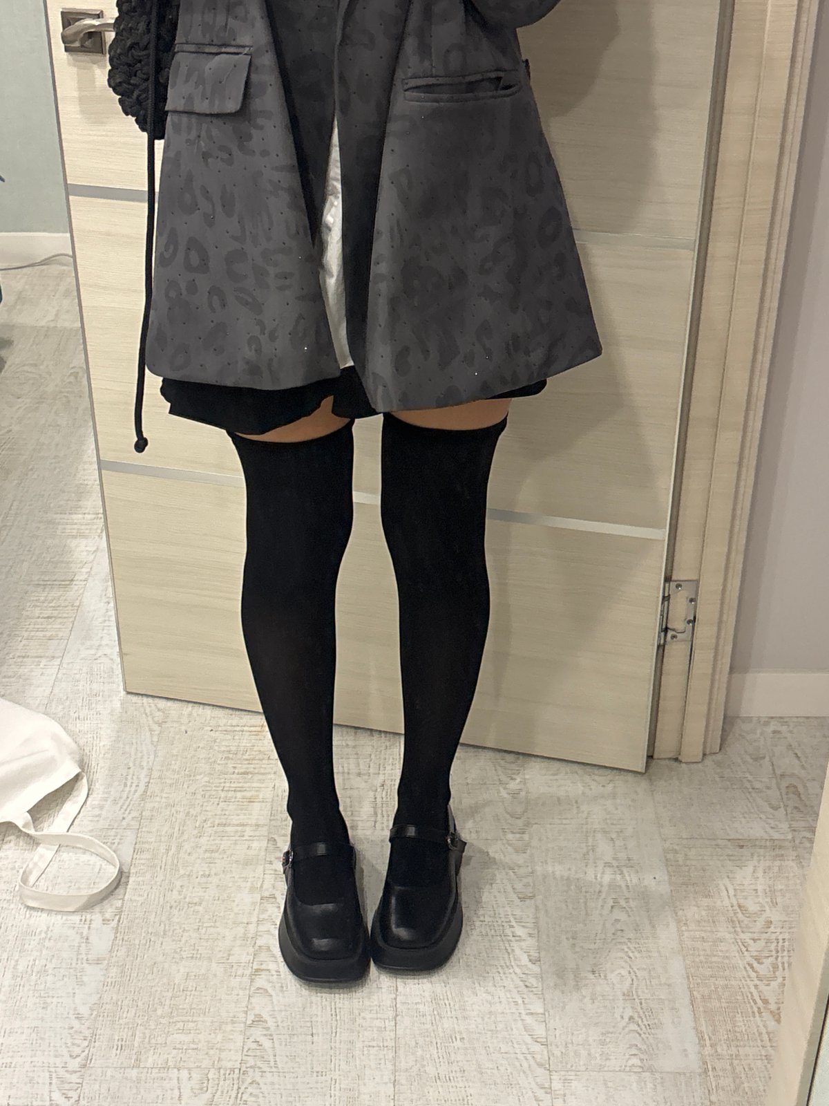 Person in dark gray clothing photographed indoors in Krasnoyarsk