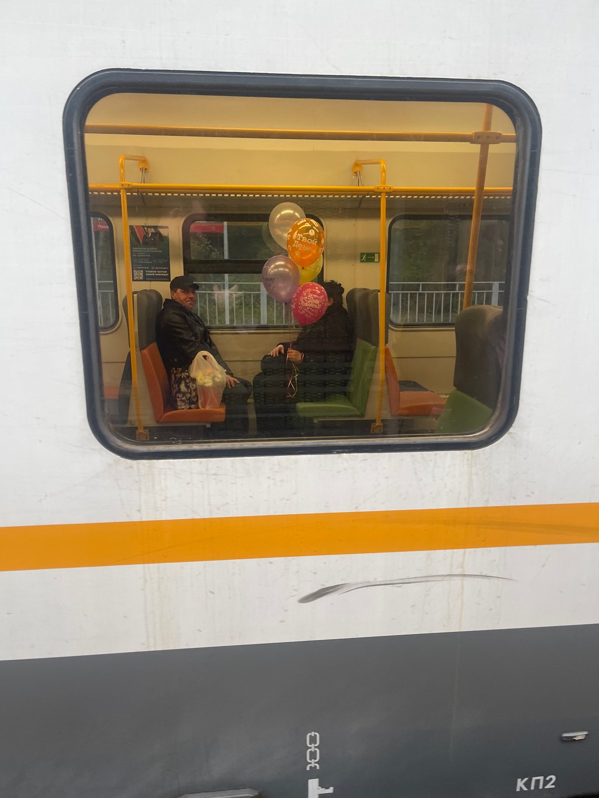 Train with balloons passes through Russian birch forest