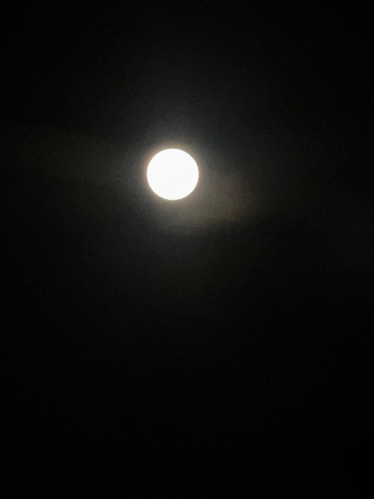 Evening moon and city lights observed across Ramat Gan