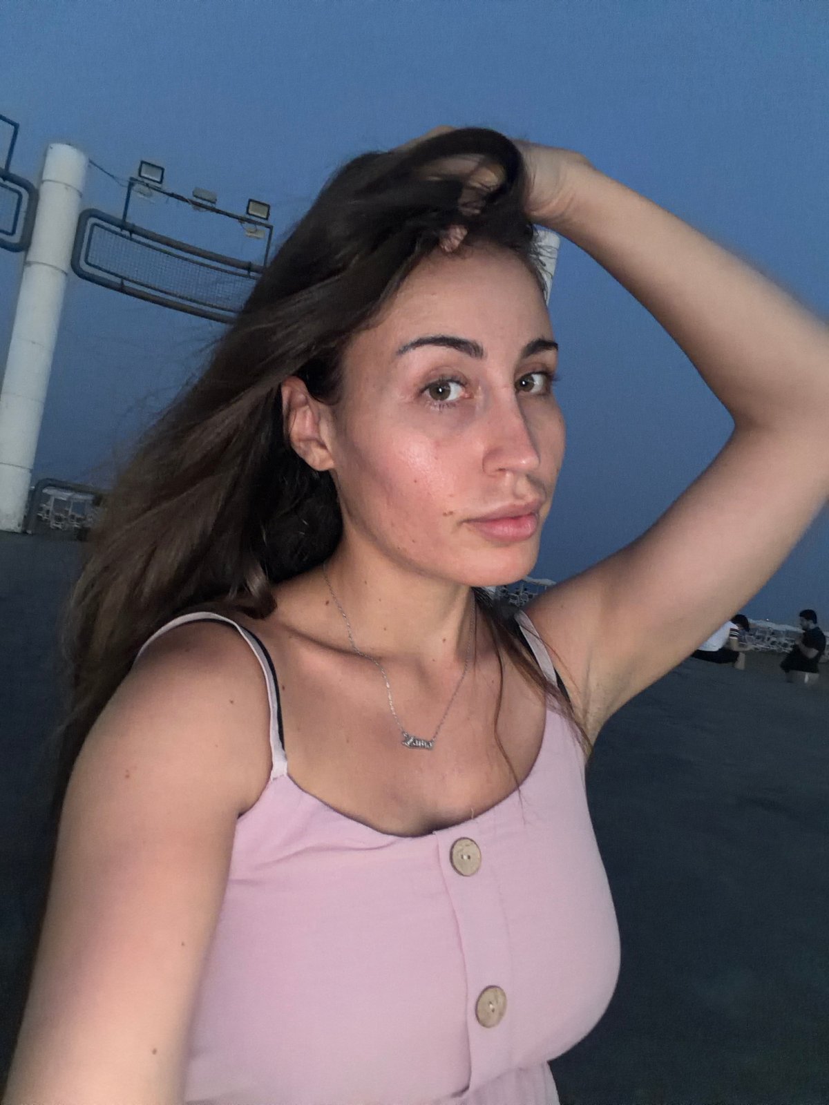 Dusk selfies and promenade scenes along Larnaca's Finikoudes waterfront