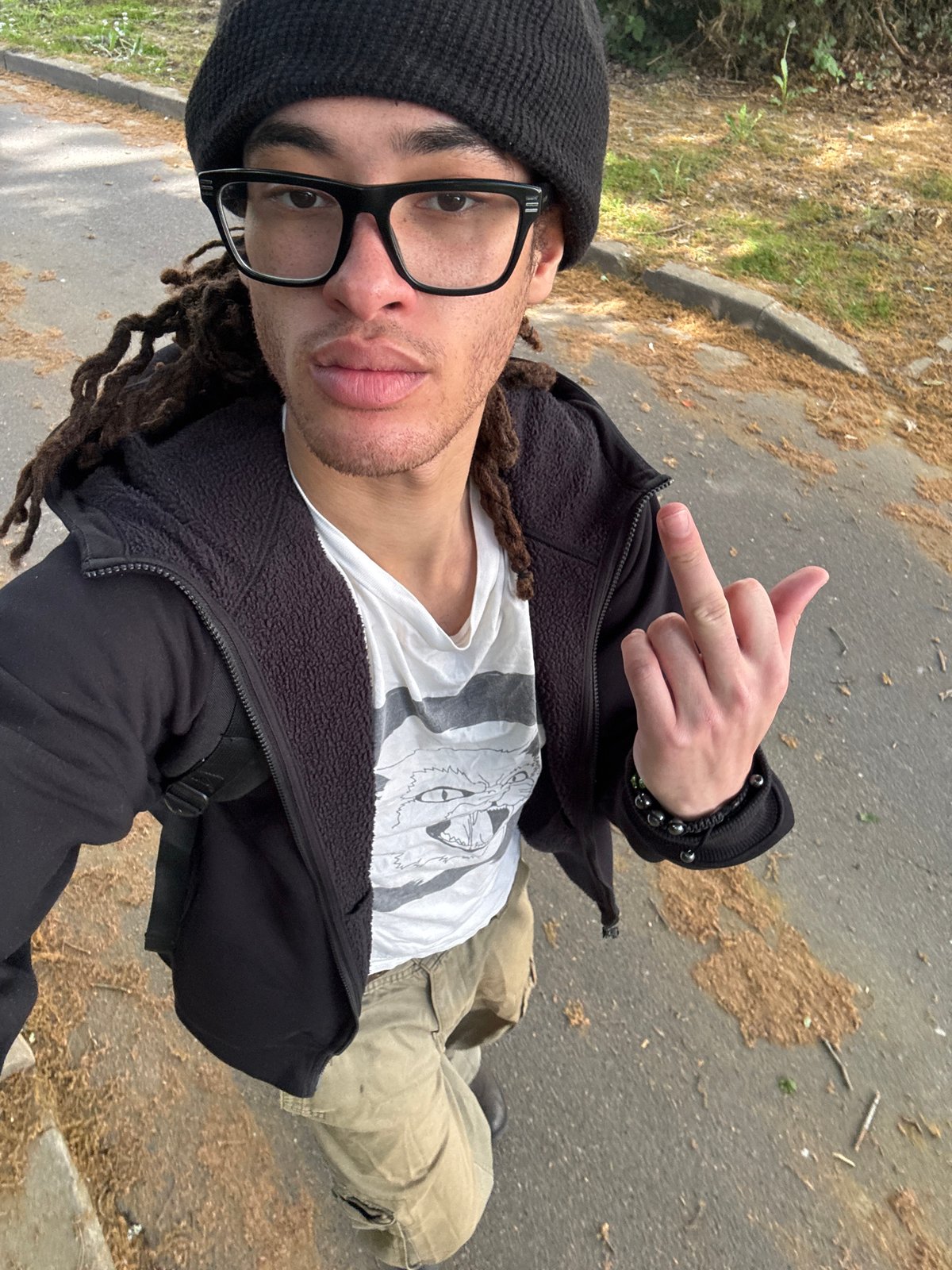 Person with dreadlocks documented around Les Ulis residential areas