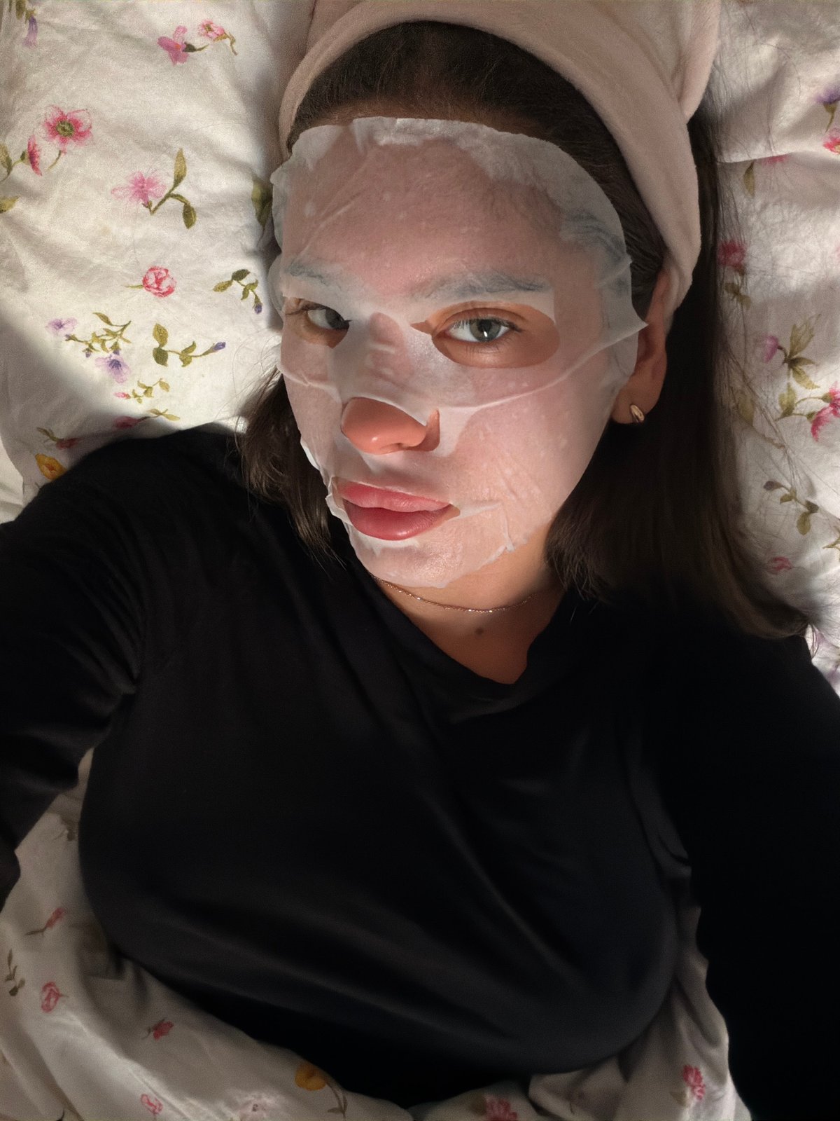 Woman performs skincare routine at home in Krasnoyarsk