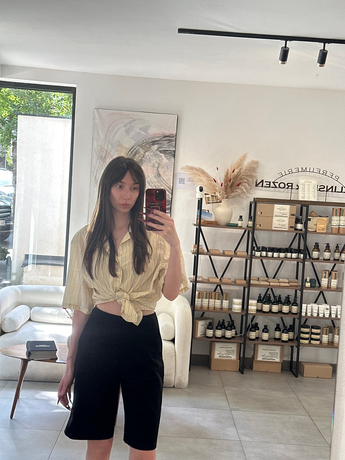 Woman takes selfies at salon in Belgrade's Vracar district