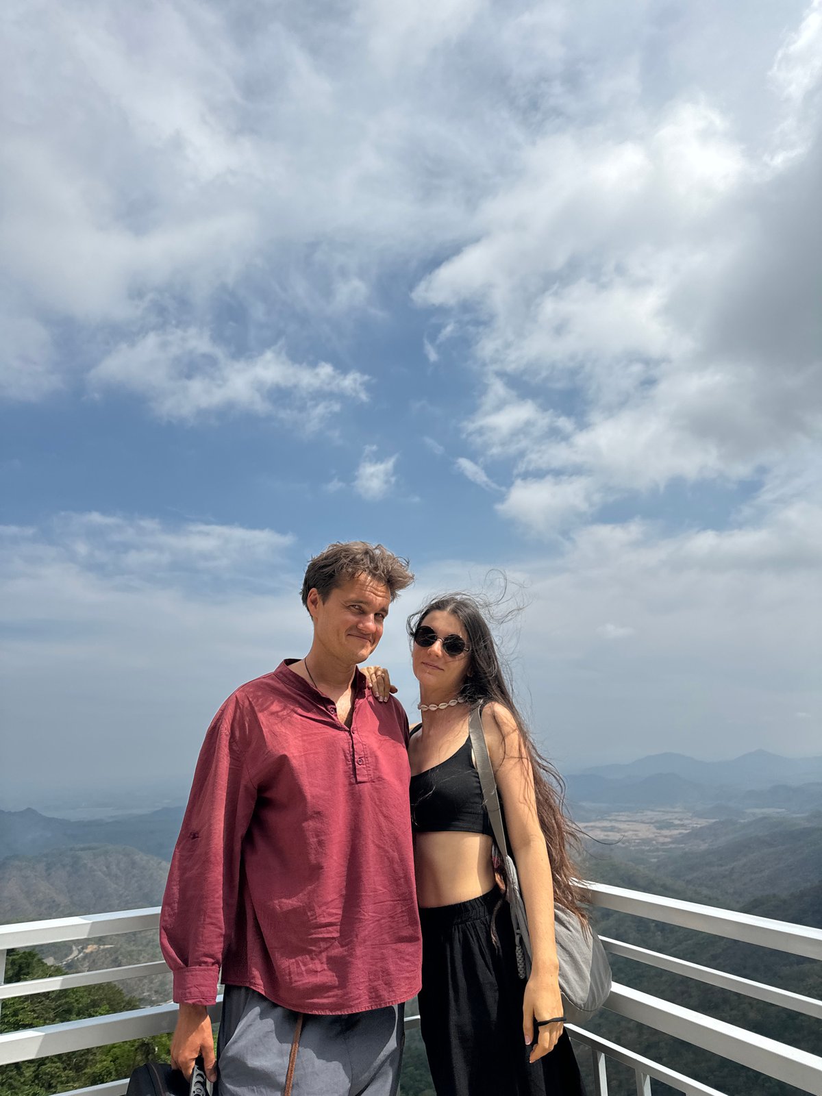 Tourists photograph mountain vistas at Nam Hải Vietnam overlooks