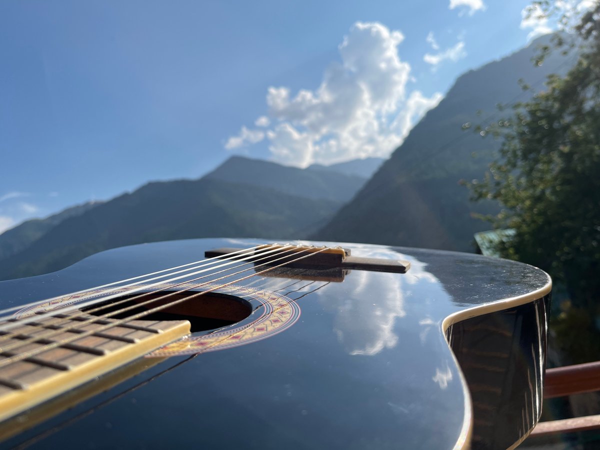 A lazy morning in Vashisht — pool, guitars, temples, and mountain streets
