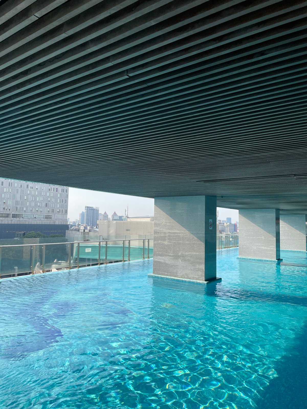 Morning pool activities documented at Jakarta rooftop facility