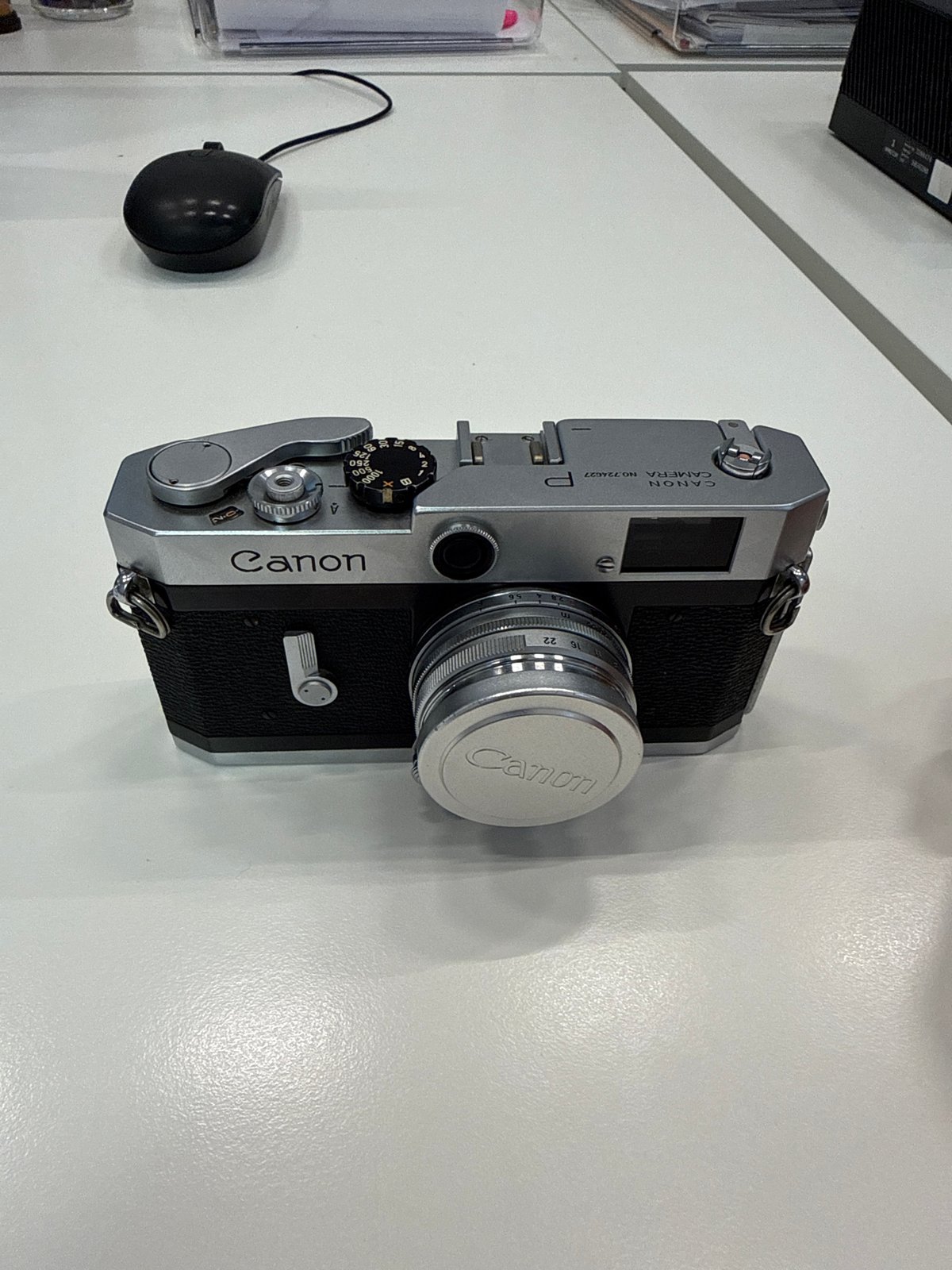 Vintage Canon camera photographed on desk in Milan