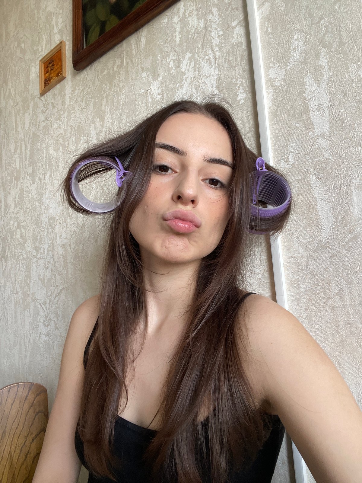Woman conducts morning beauty routine in Moscow apartment