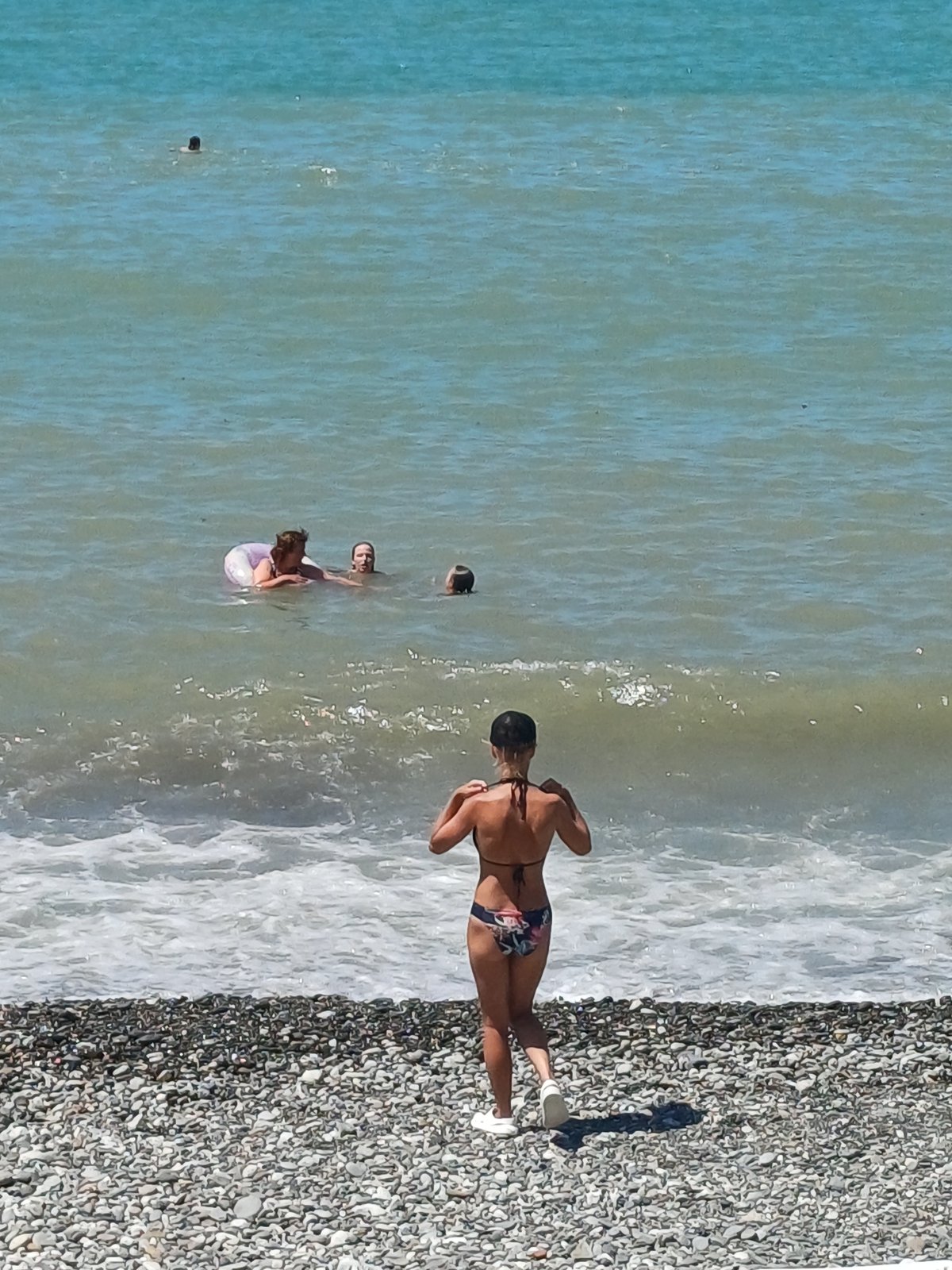 Sochi's Black Sea beach buzzing on a sunny summer morning
