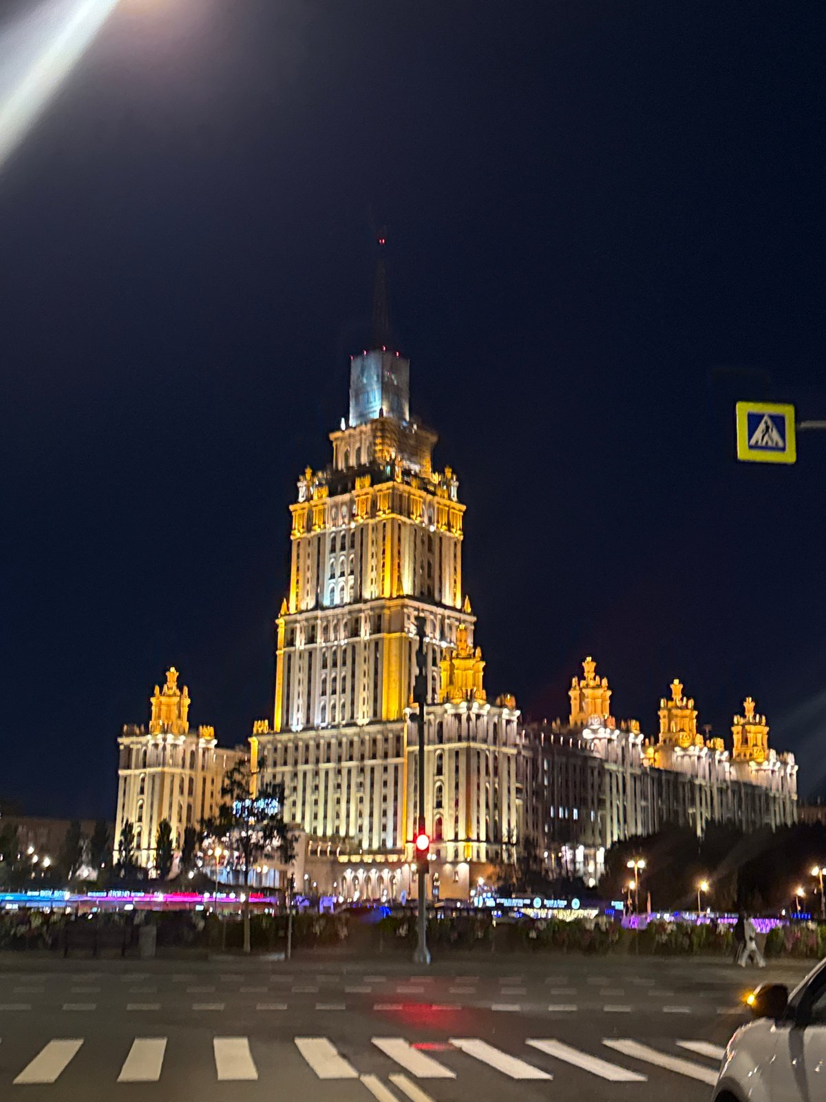 Nighttime drive past Moscow's illuminated Hotel Ukraina
