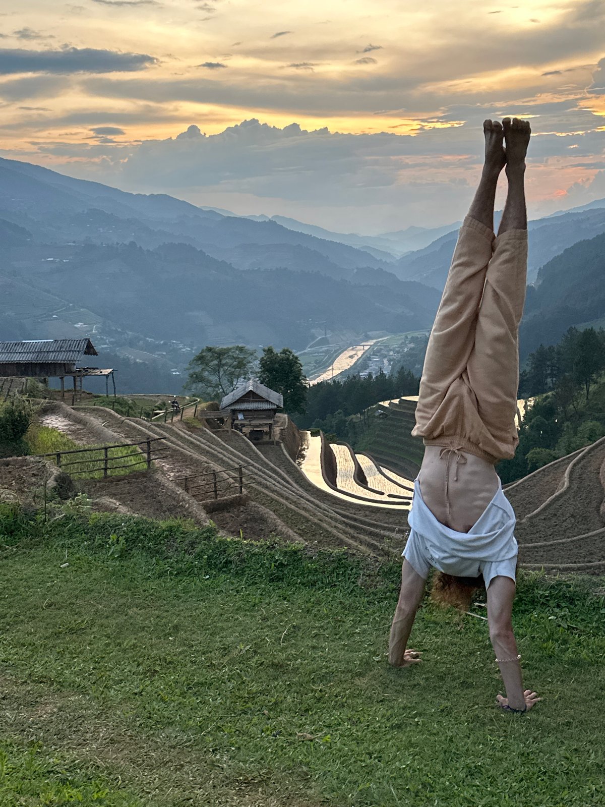 Family visits Vietnam's Mù Cang Chải rice terraces during sunset
