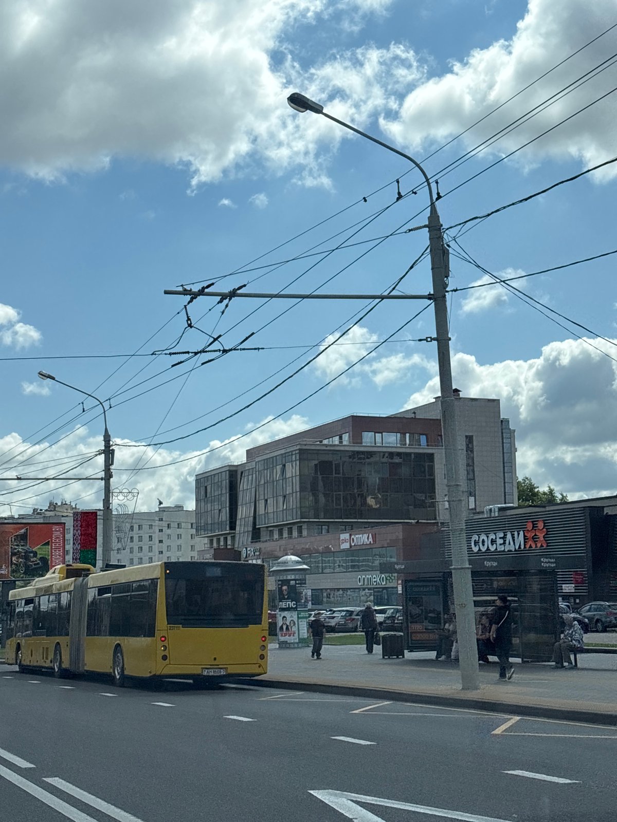 Yellow articulated bus on a Minsk city street