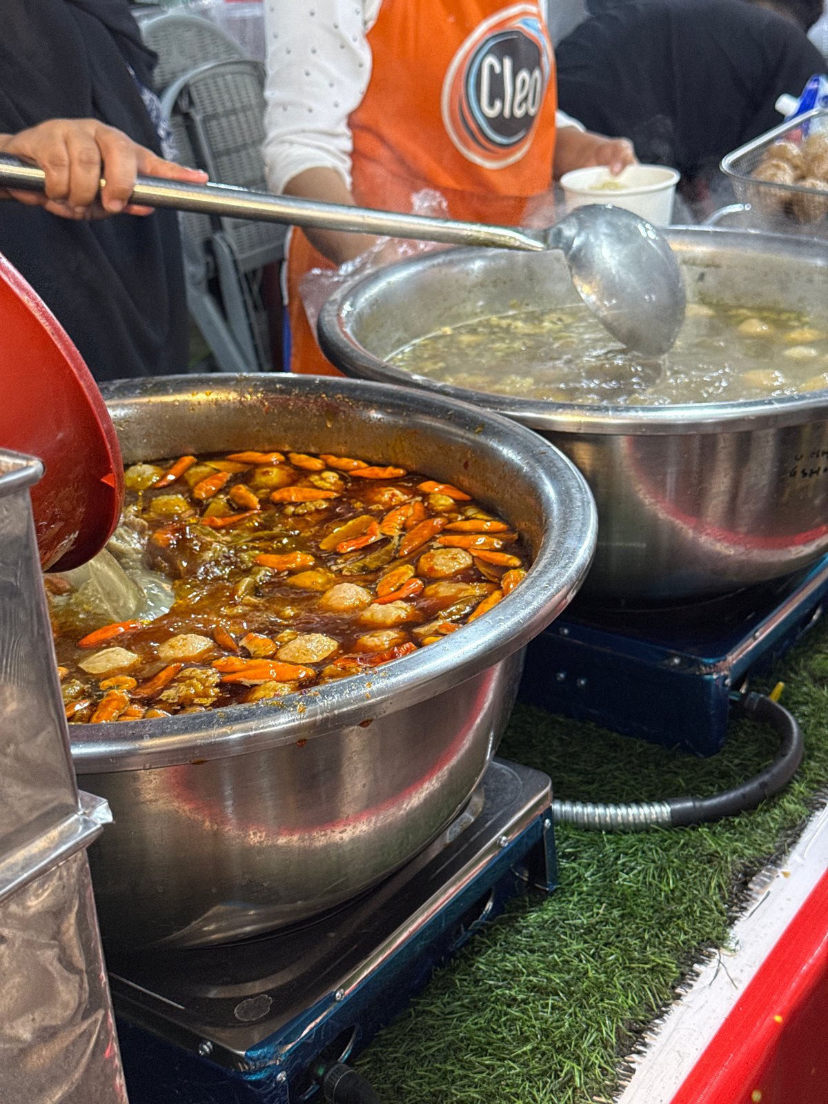 Street food vendors serve customers across Lhokseumawe, Indonesia