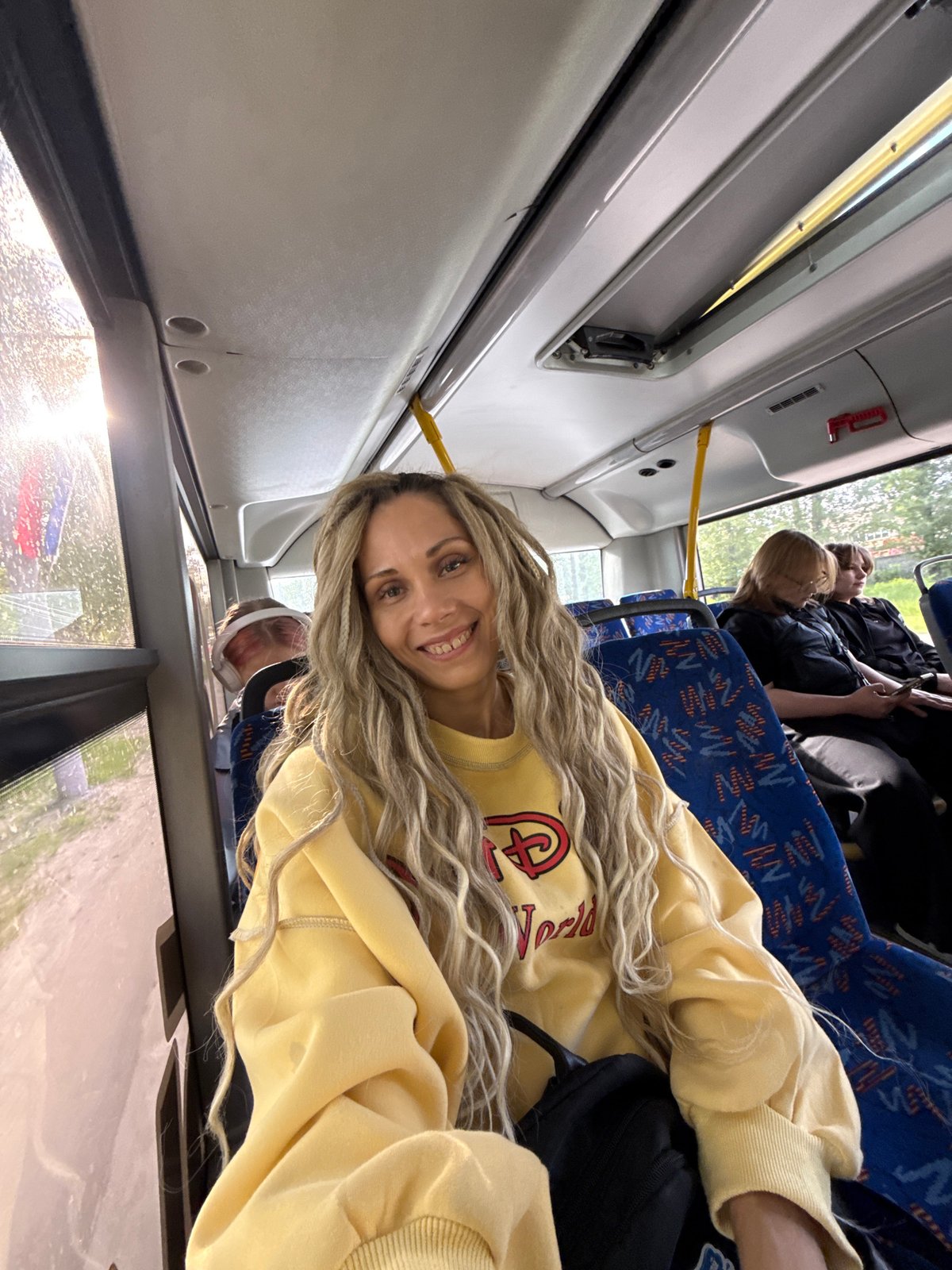 Transit scenes captured in Rusanovo: bus passenger, elevated railway view