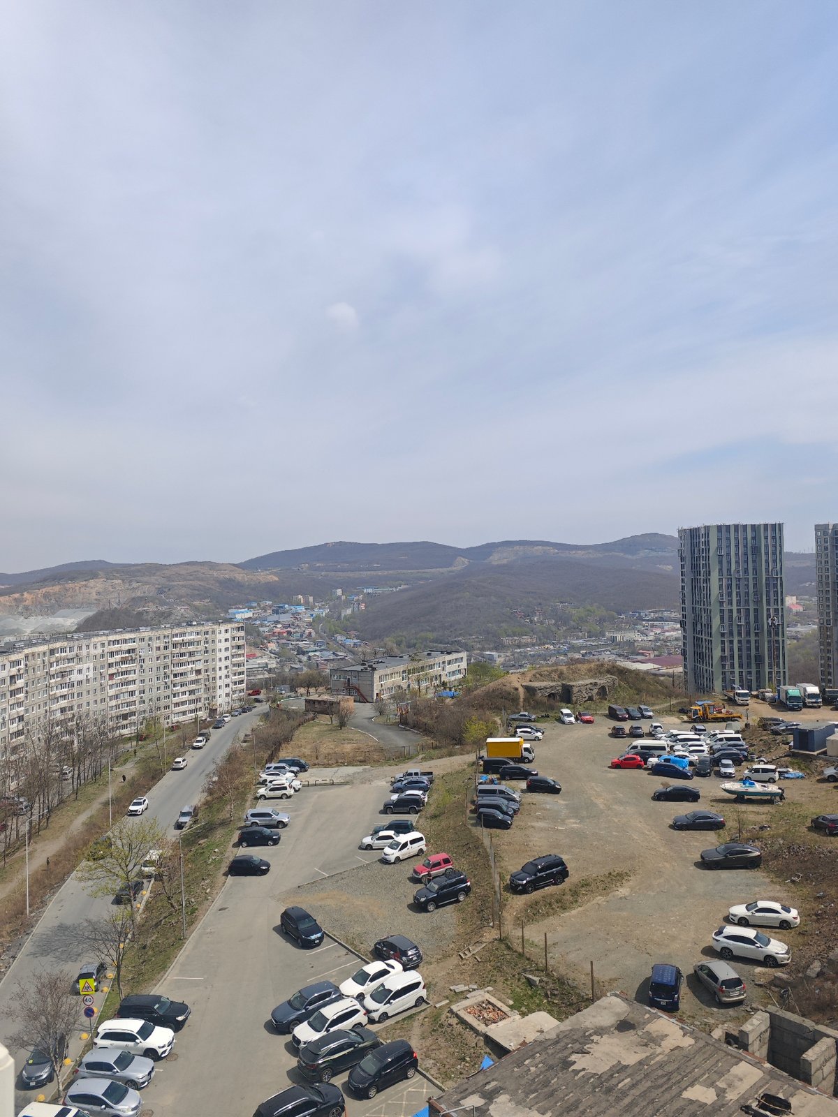 Elevated cityscape view documented in Vladivostok under overcast conditions