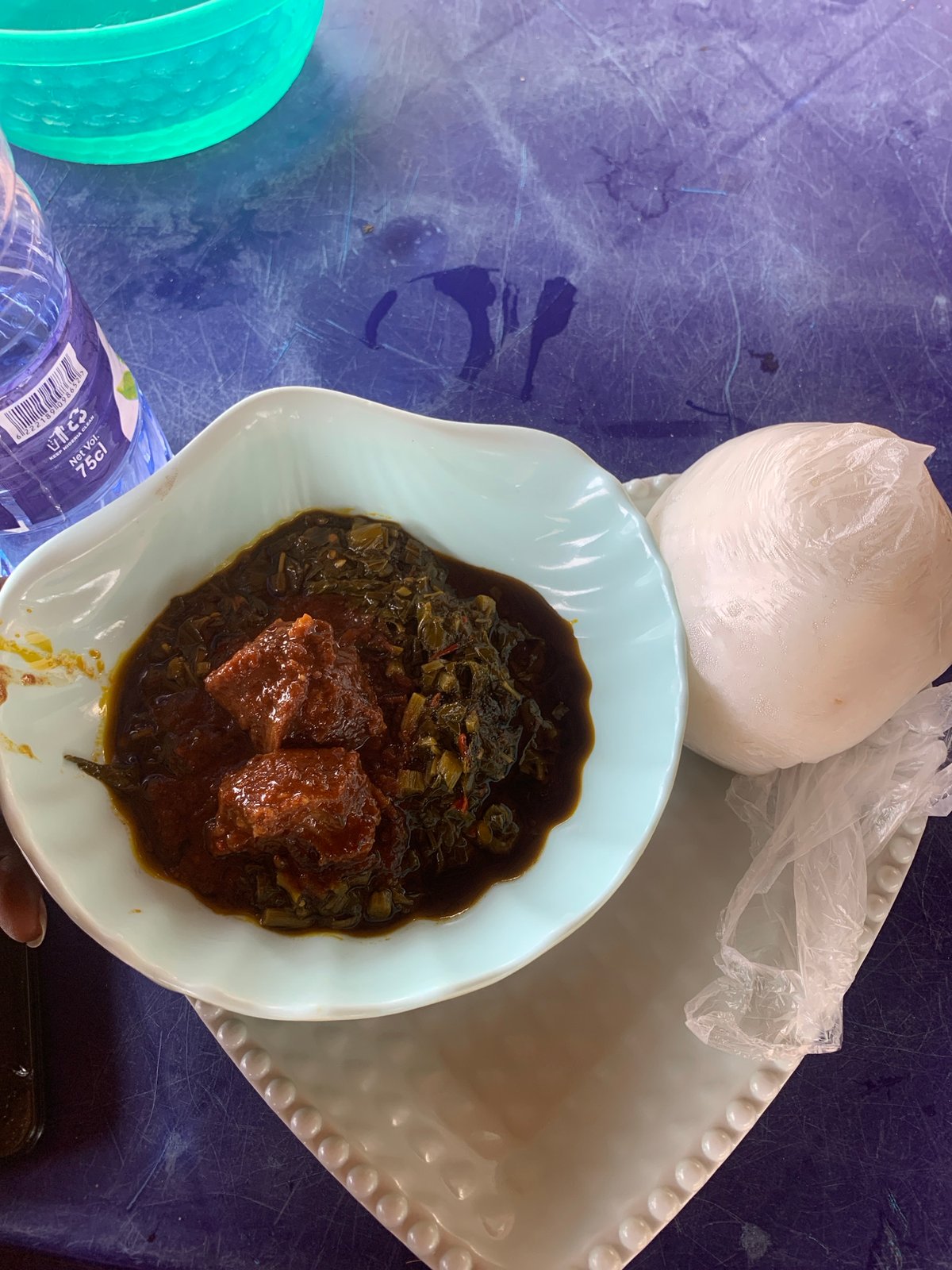 Food and everyday life around a thatched shelter in Jalingo