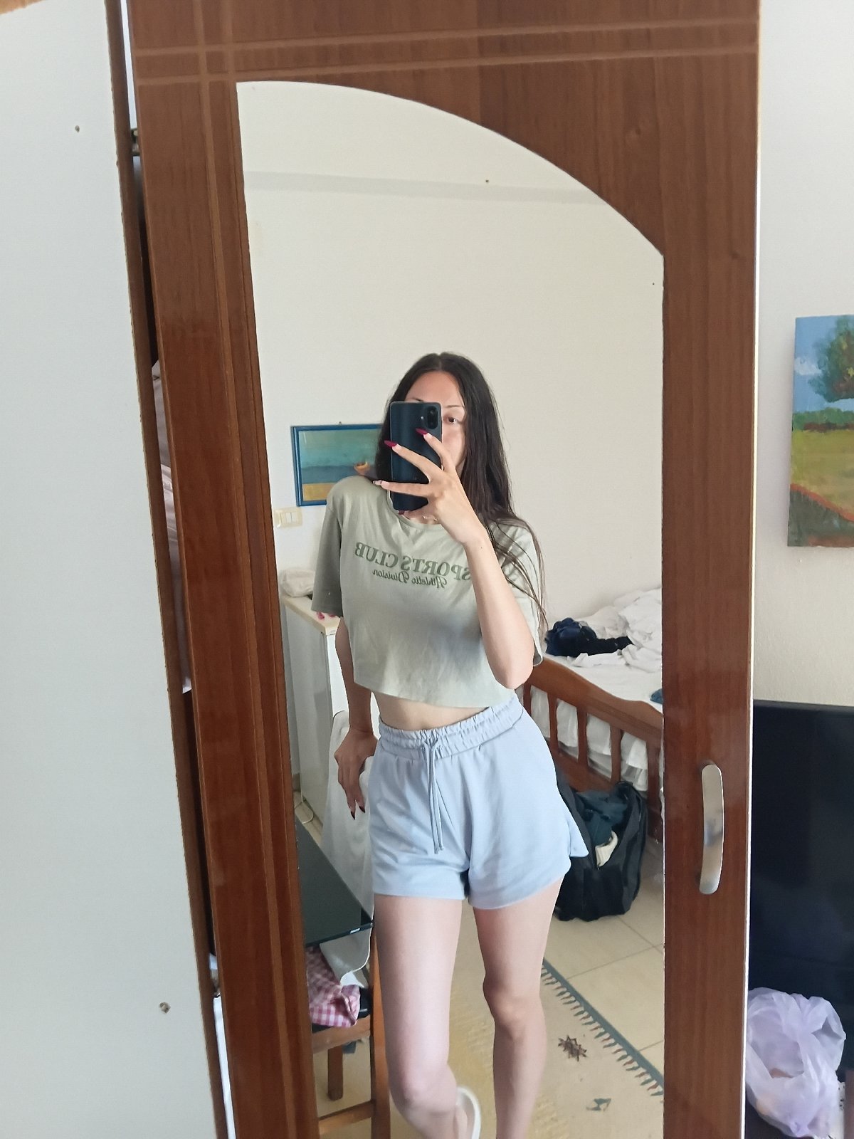 Woman takes morning selfies in Vlora, Albania residence