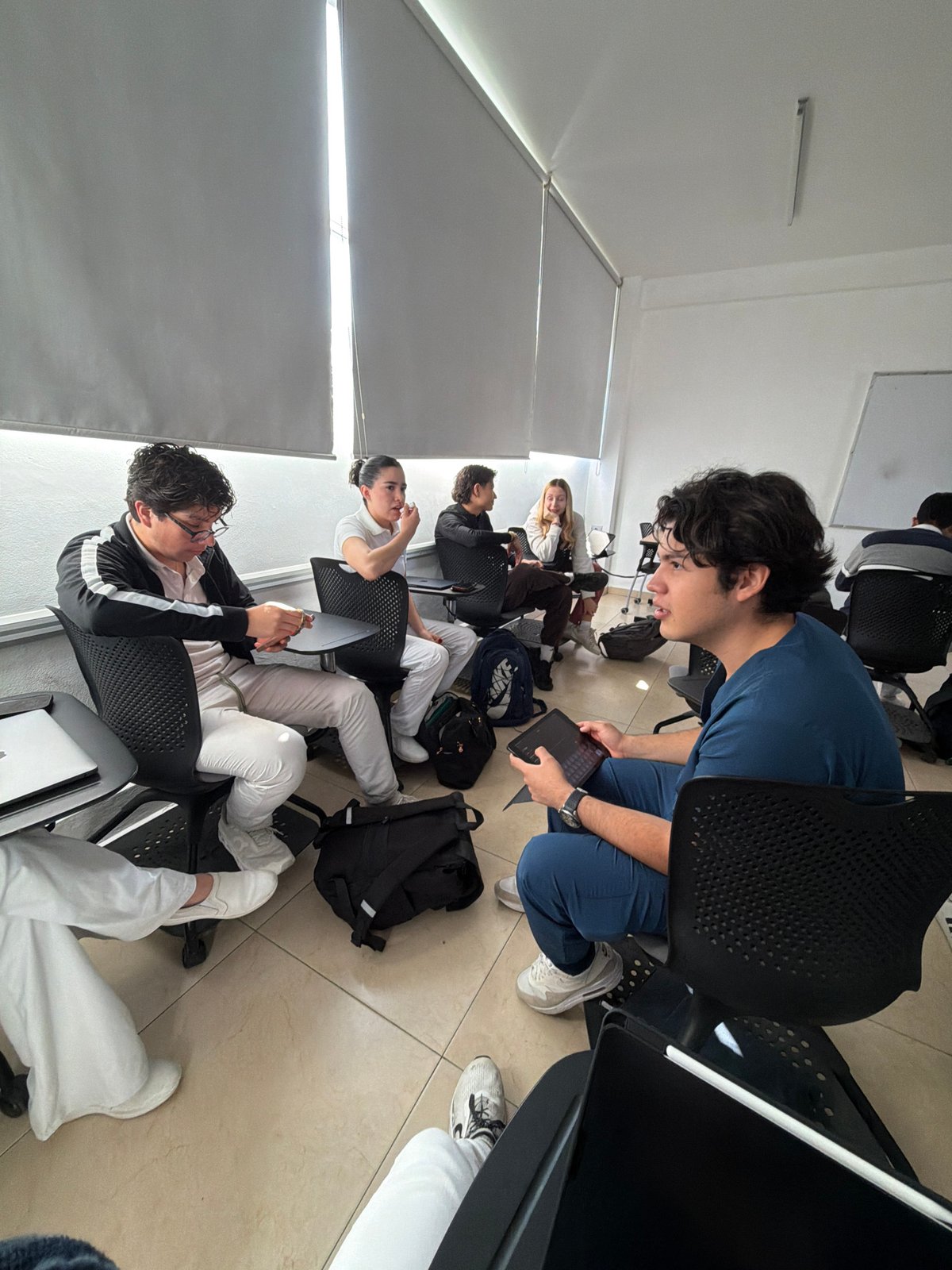 Young adults gathered in indoor space in Puebla