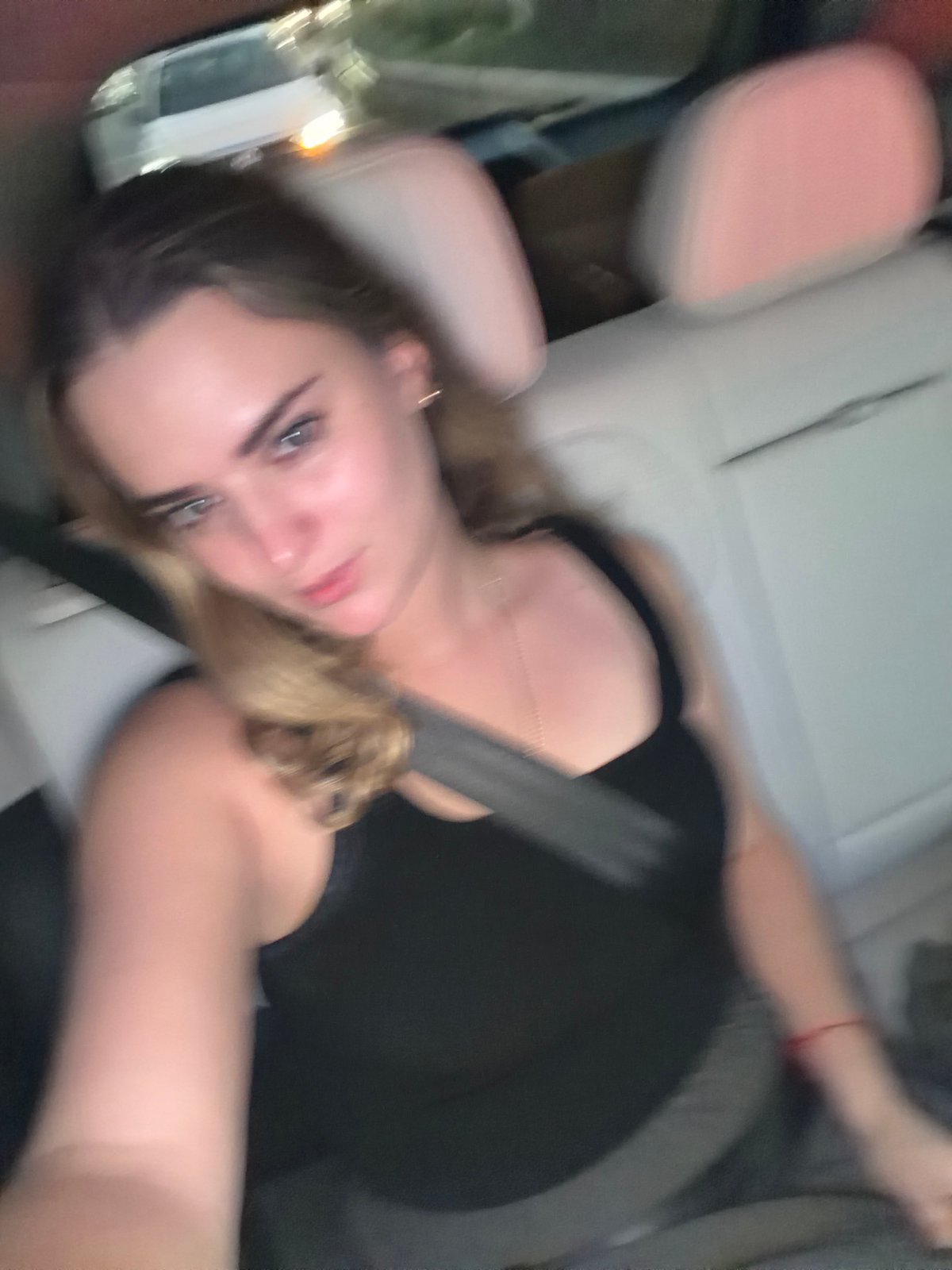 Person photographed reclining in car in Tlaxcalancingo, Mexico