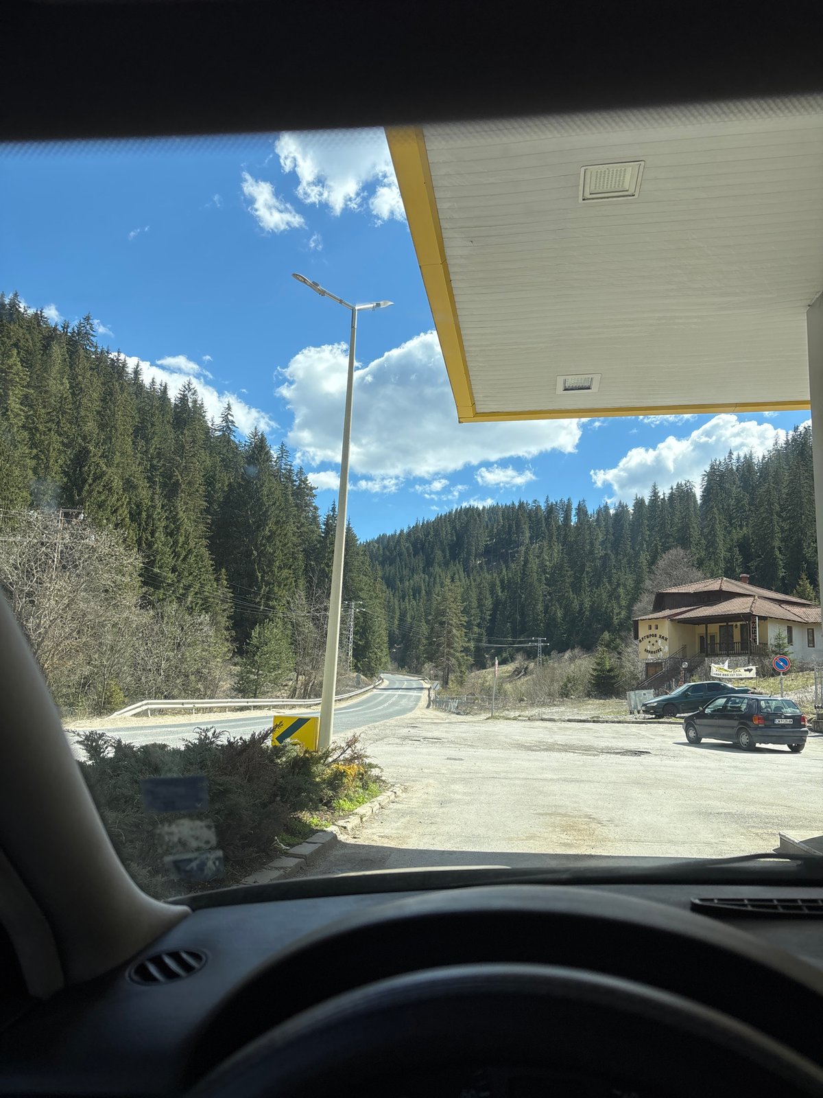 Driver documents street view in Chepelare, Bulgaria