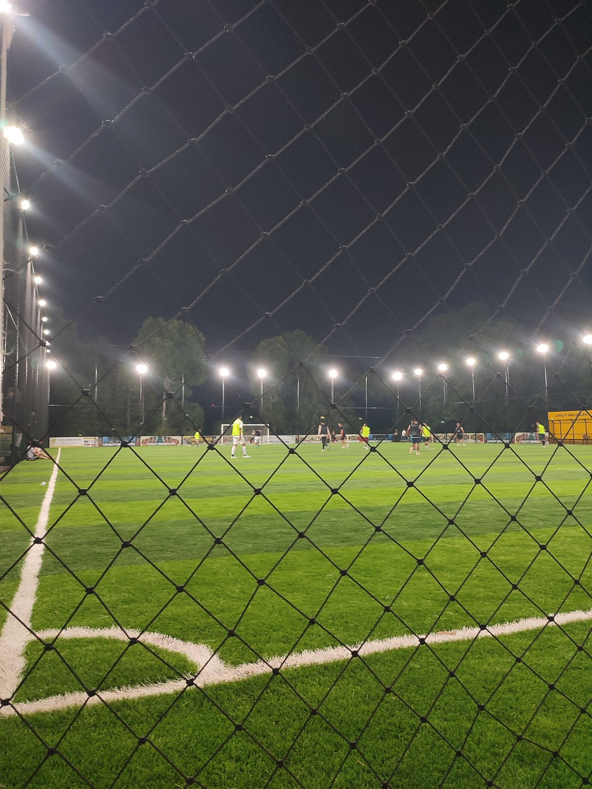 Evening soccer match draws players to lit Titibaro field