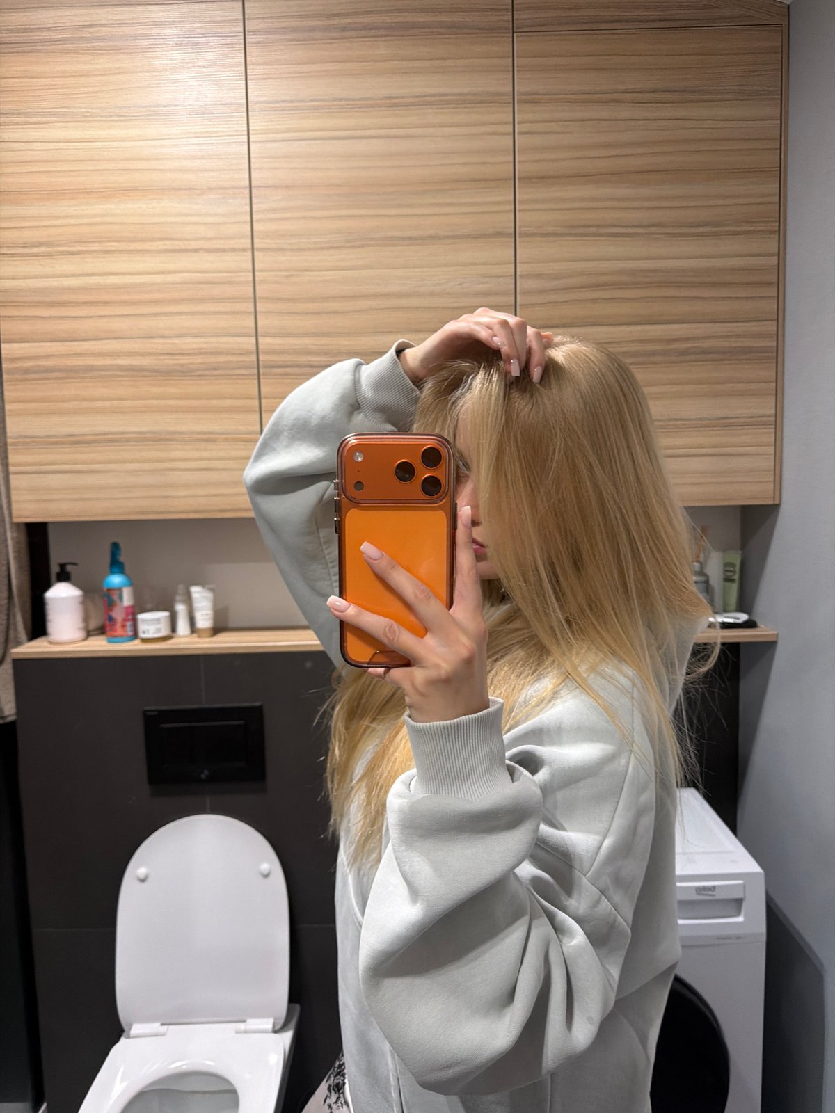 Evening routine captured: bathroom selfie, bedroom video watching session