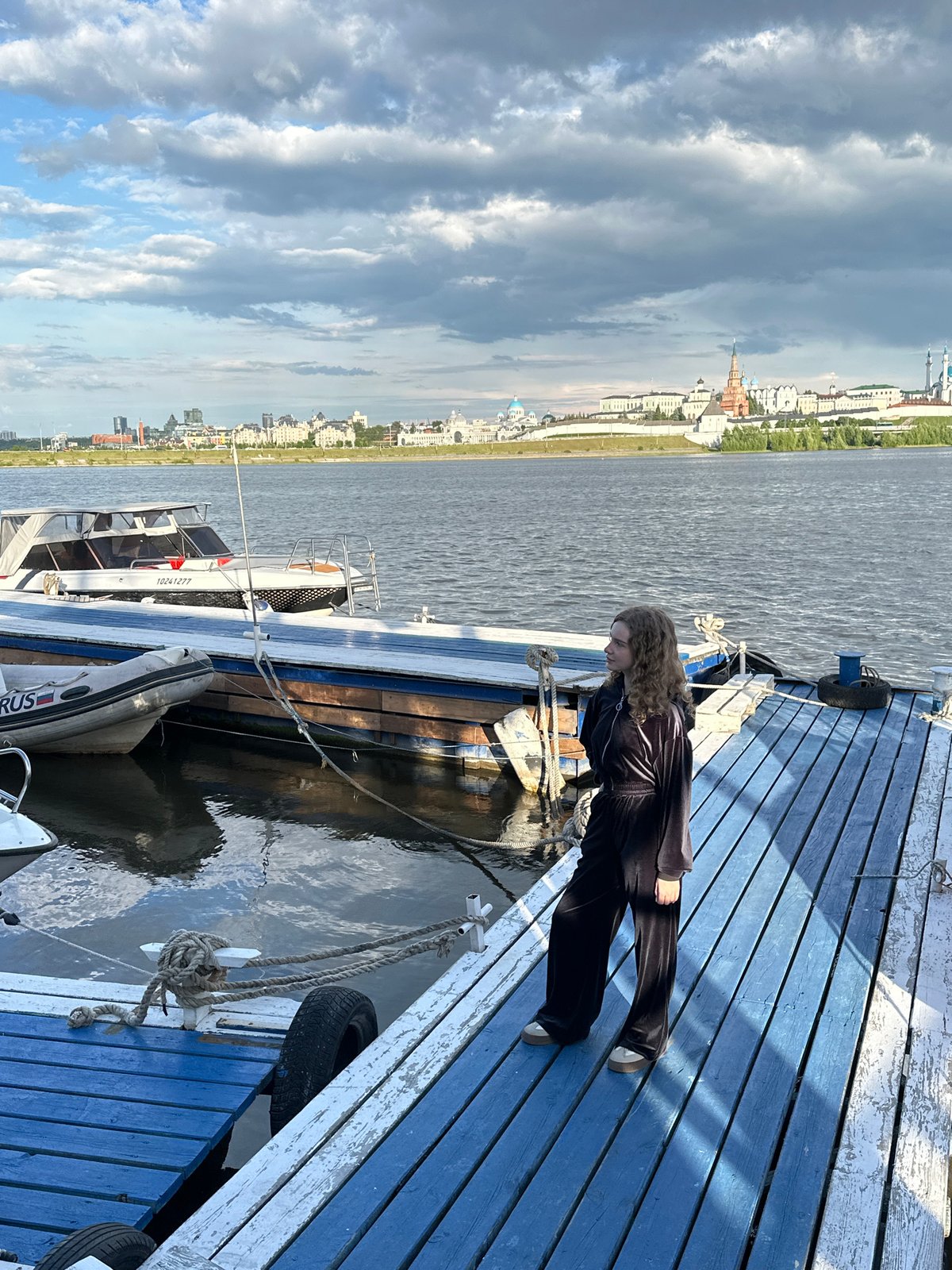 Woman spends afternoon at Kazan riverside marina dock