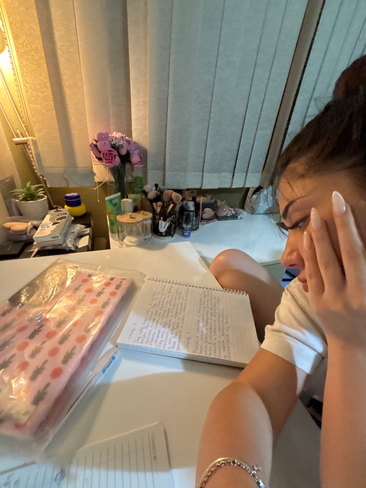 Student studies, takes selfies during homework session in Plovdiv