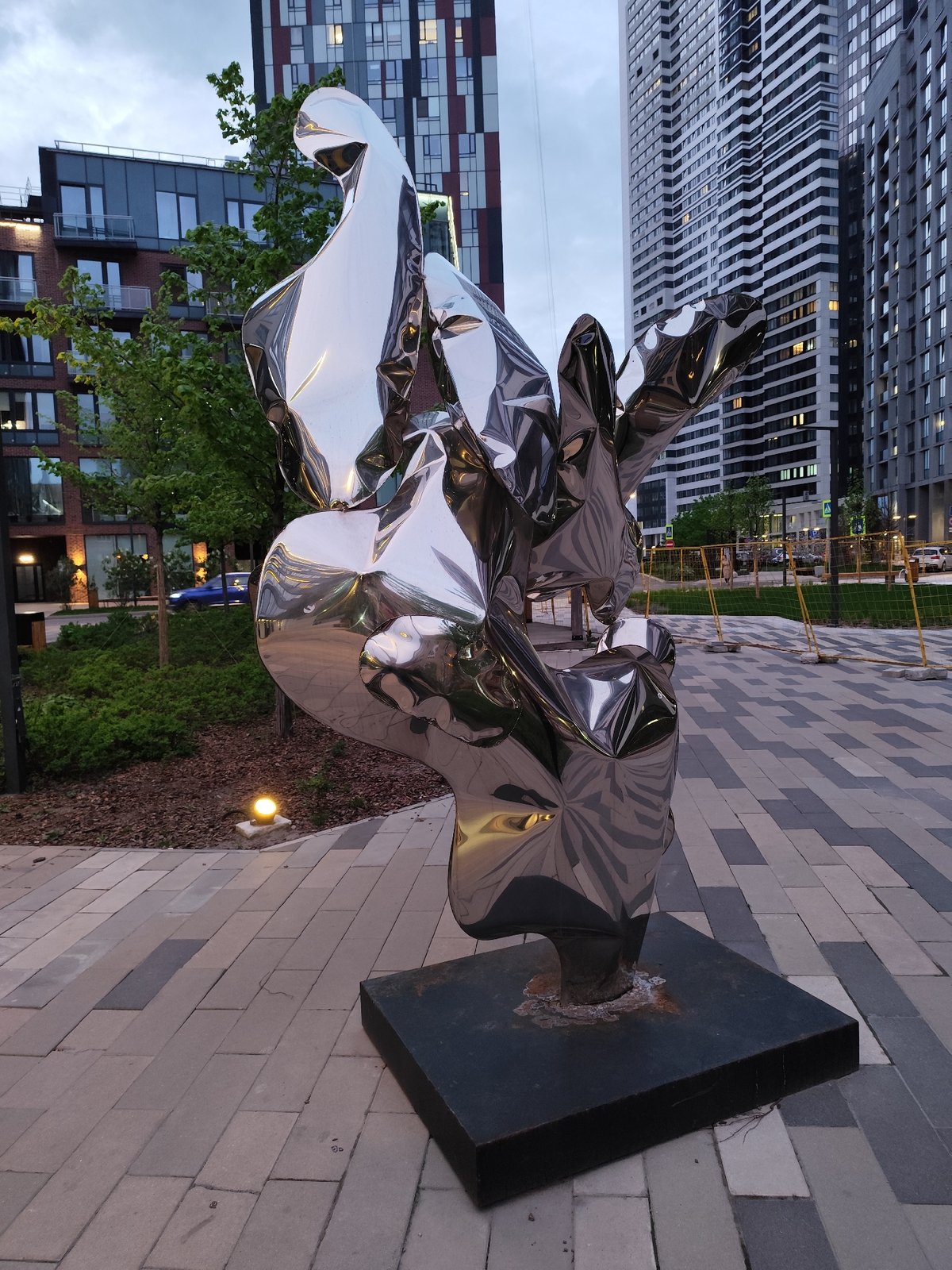 Modern steel sculpture observed in Moscow urban setting