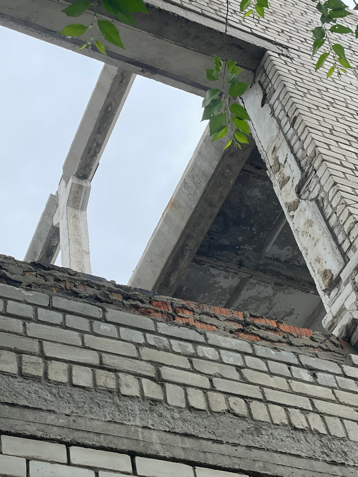 Abandoned building's decaying interior captured in upward view