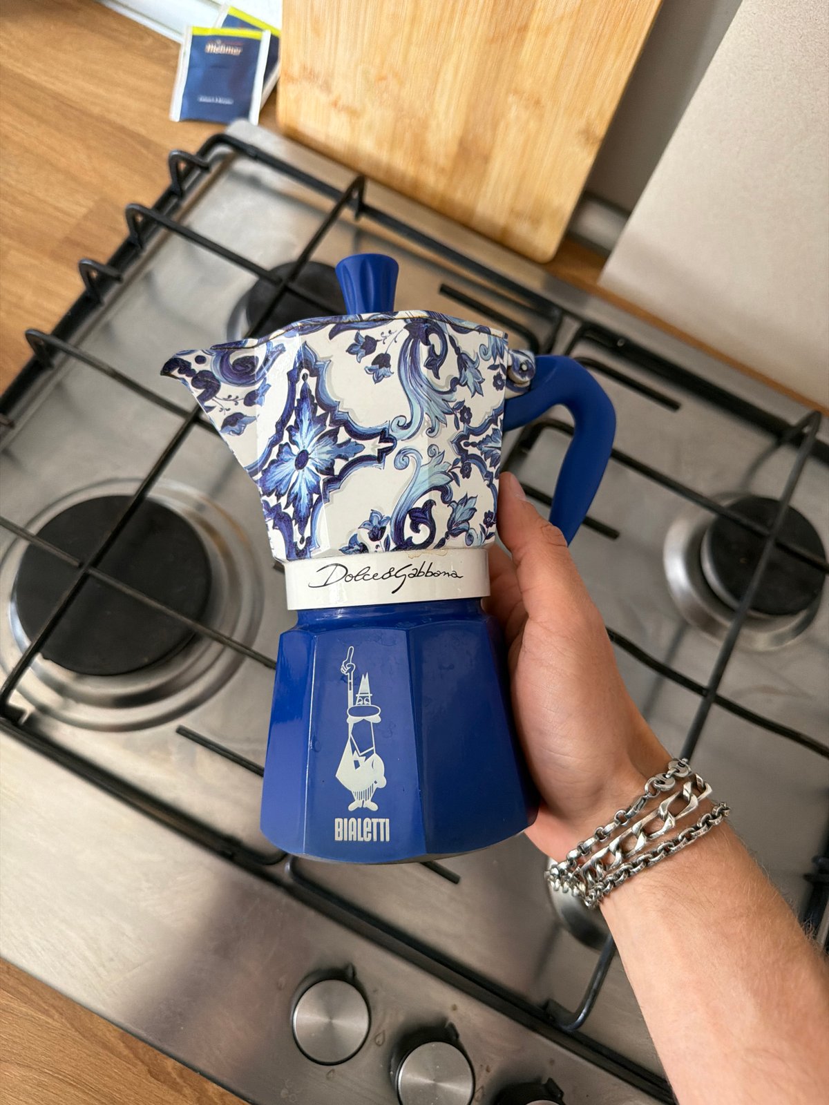 Milan resident prepares coffee with designer espresso maker, celebrates tradition