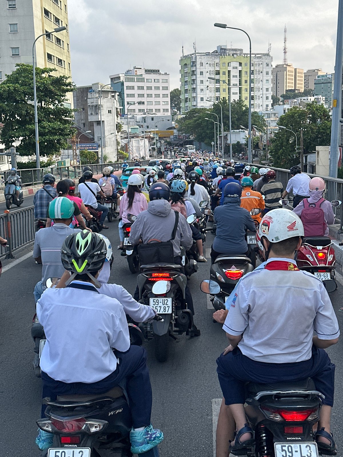 Dense motorcycle traffic clogs Ho Chi Minh City bridge