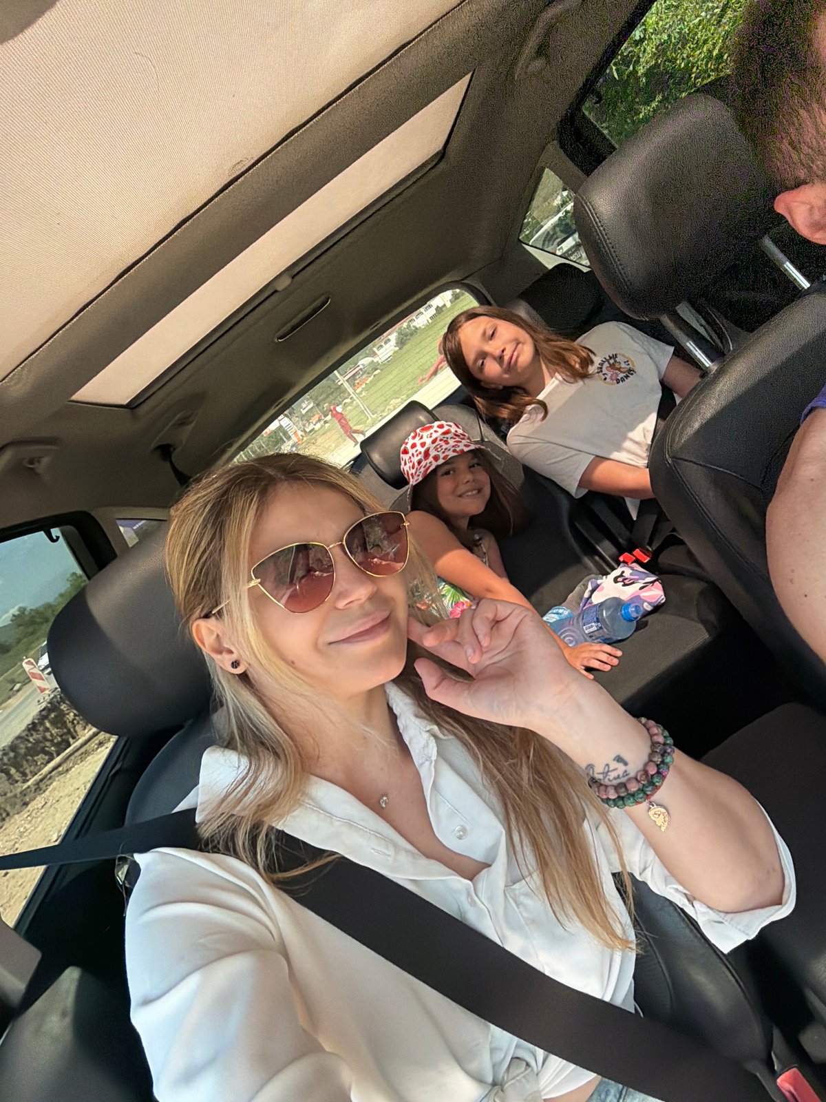 Woman and children travel by car in Montenegro