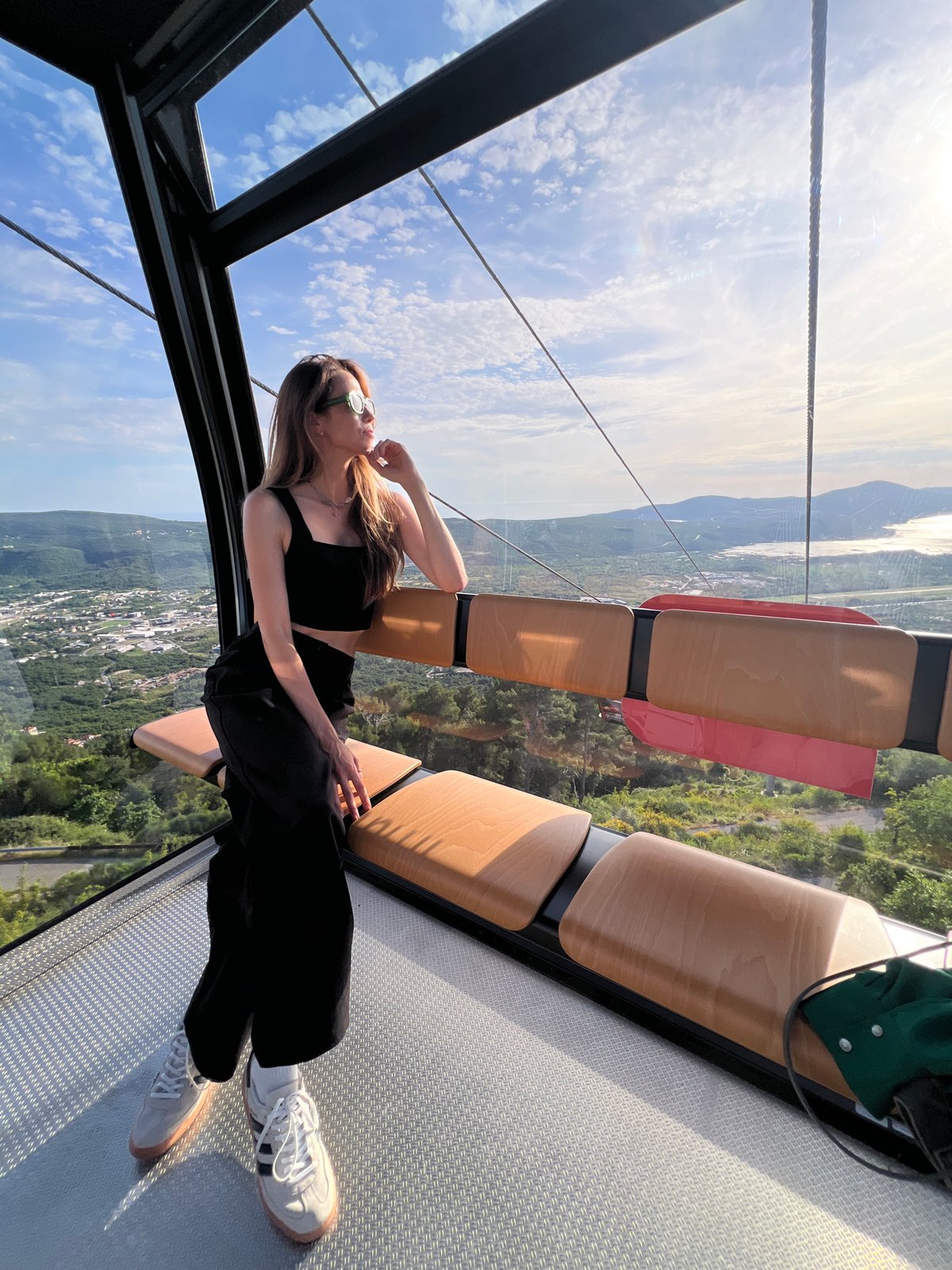 Woman enjoys scenic cable car ride through Montenegro countryside