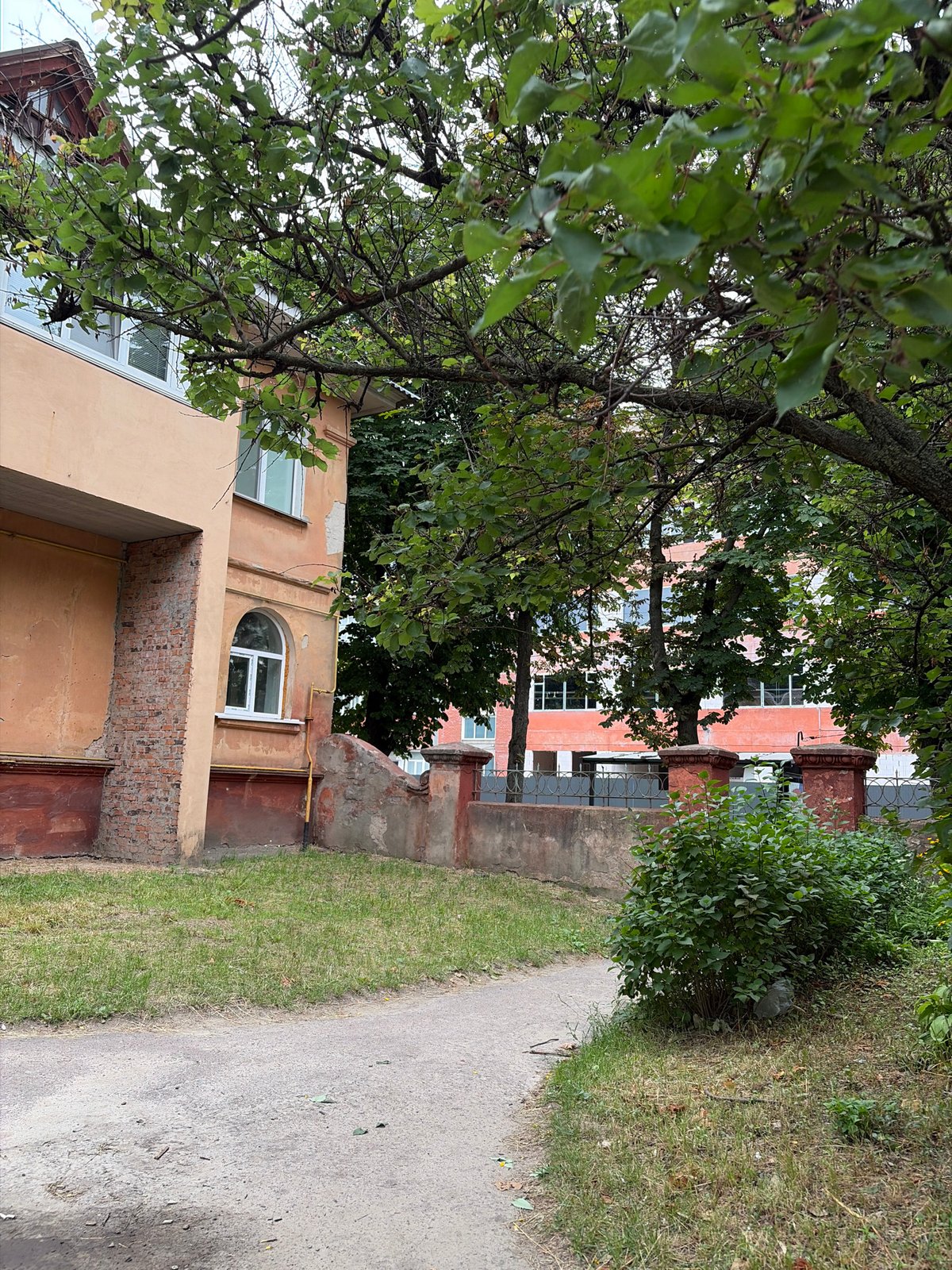 Urban streetscape with brick apartments and a construction site