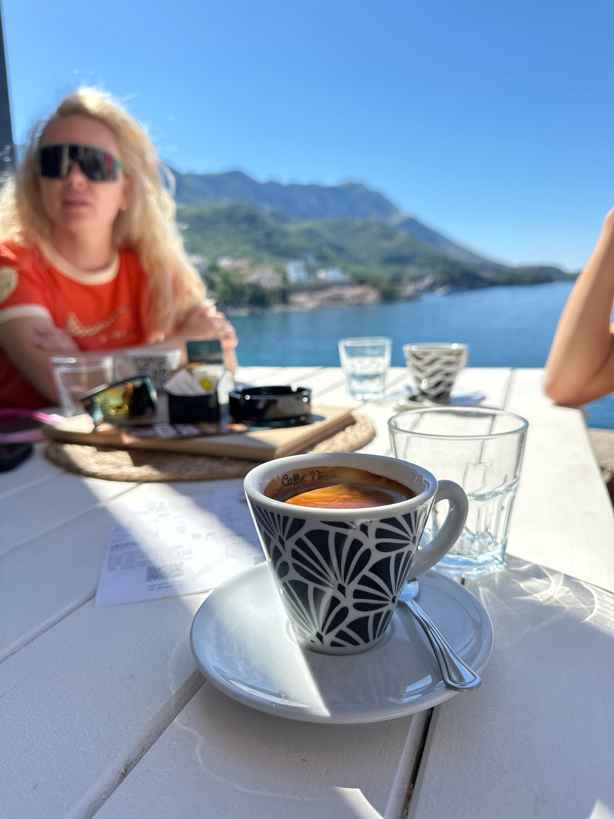 Morning coffee shared at coastal table in Boreti, Montenegro